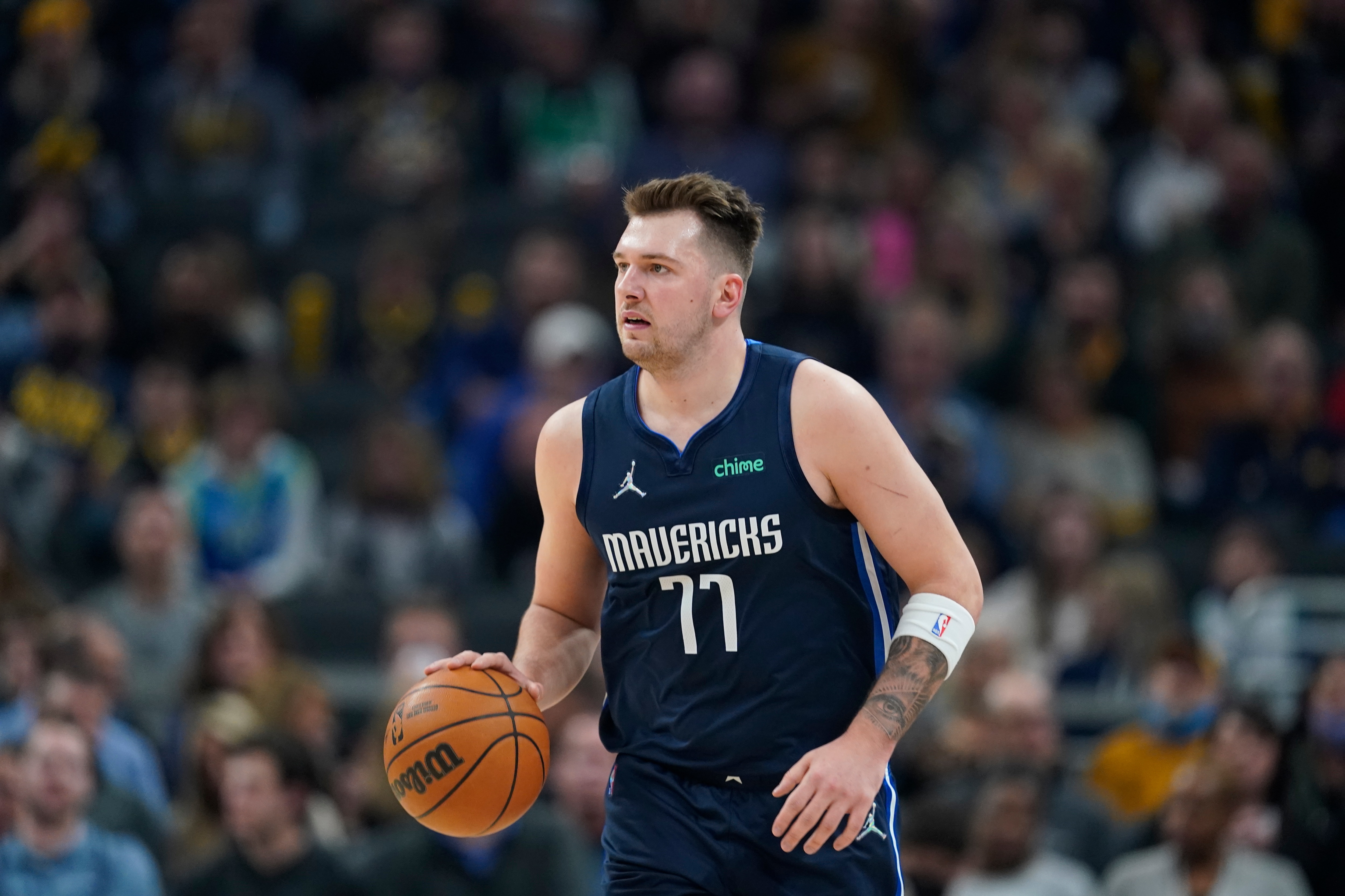 Dallas Mavericks' Luka Doncic dribbles during the first half of an NBA basketball game against the Indiana Pacers, Friday, Dec. 10, 2021, in Indianapolis. (AP Photo/Darron Cummings)