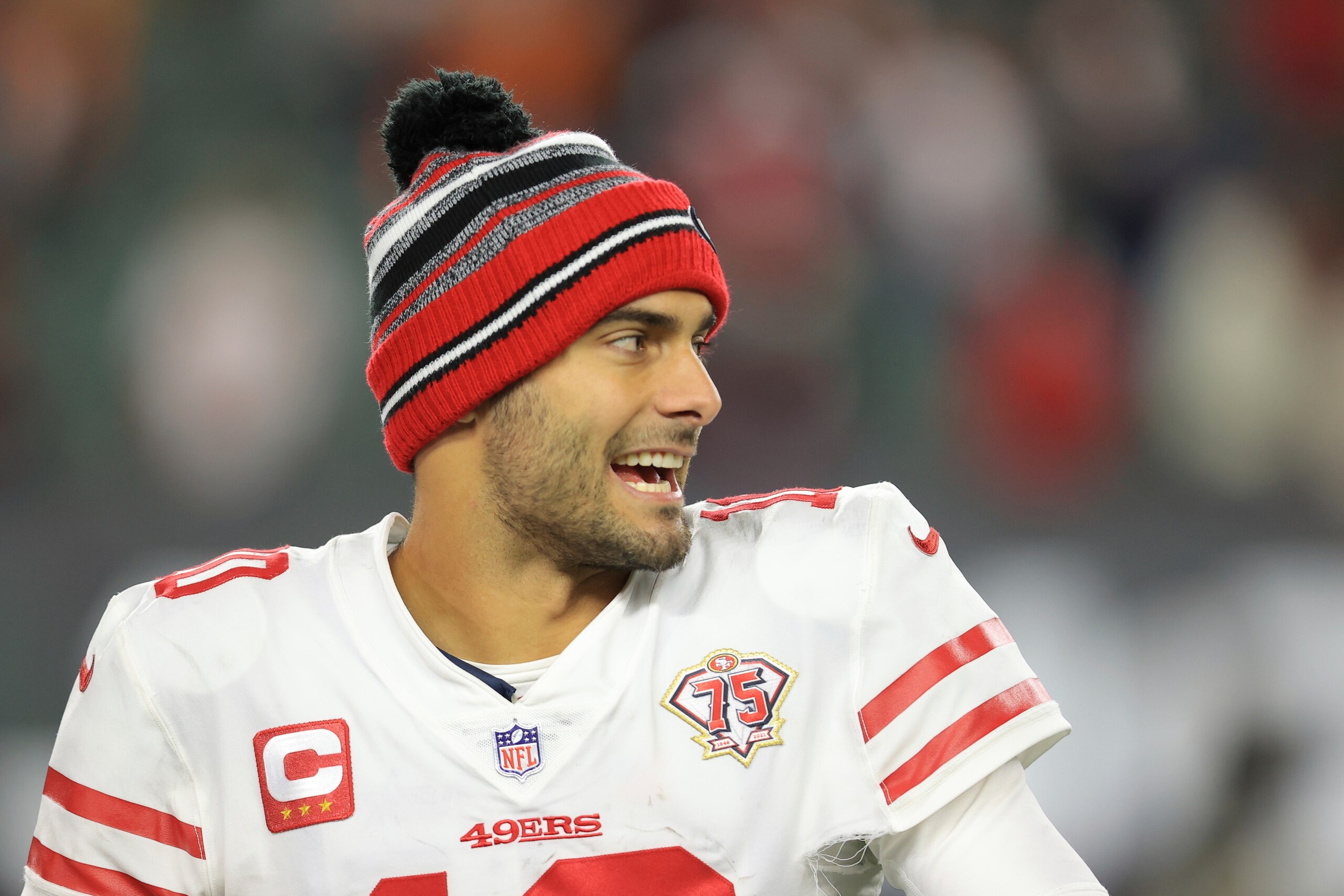 San Francisco 49ers quarterback Jimmy Garoppolo (10) smiles following an overtime win against the Cincinnati Bengals in an NFL football game, Sunday, Dec. 12, 2021, in Cincinnati. (AP Photo/Aaron Doster)