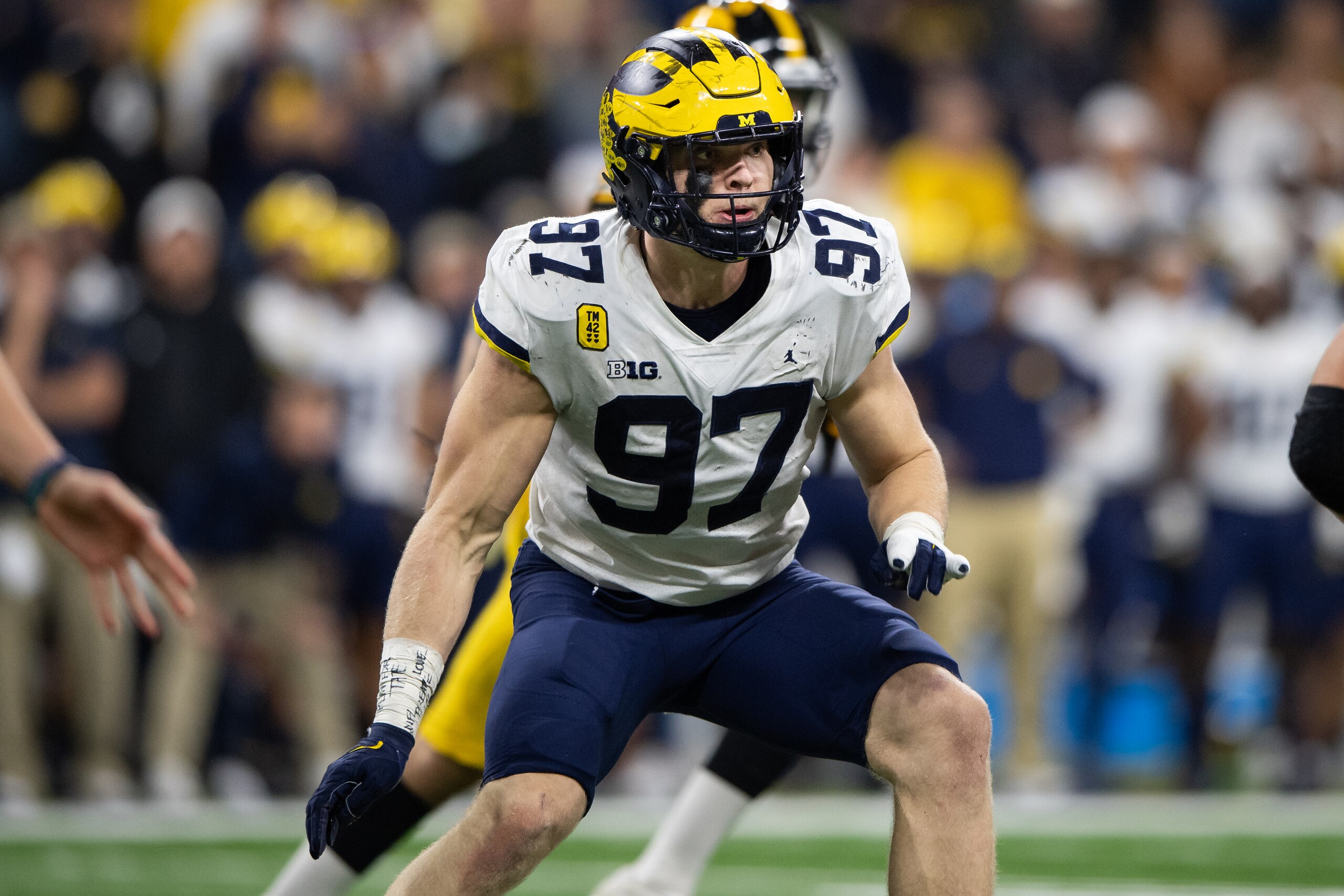 INDIANAPOLIS, IN - DECEMBER 04: Michigan Wolverines defensive end Aidan Hutchinson (97) rushes into the backfield during the Big 10 Championship game between the Michigan Wolverines and Iowa Hawkeyes on December 4, 2021, at Lucas Oil Stadium in Indianapolis, IN. (Photo by Zach Bolinger/Icon Sportswire via Getty Images)