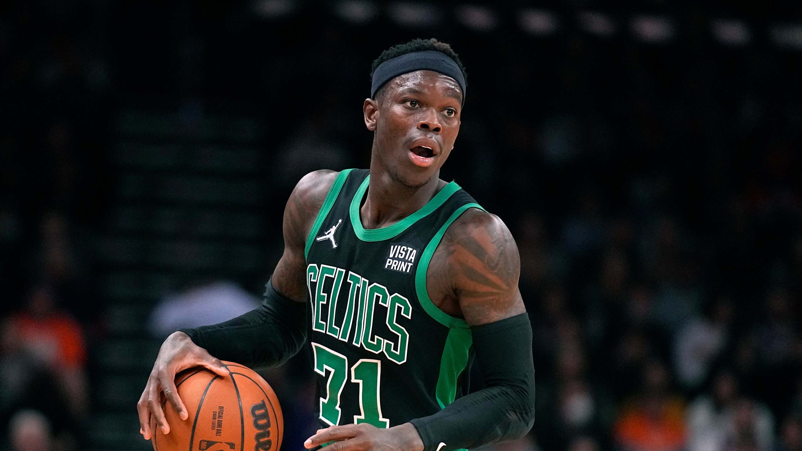 Boston Celtics guard Dennis Schroder (71) during the first half of an NBA basketball game against the Phoenix Suns, Friday, Dec. 10, 2021, in Phoenix. (AP Photo/Rick Scuteri) Boston Celtics guard Dennis Schroder (71) during the first half of an NBA basketball game against the Phoenix Suns, Friday, Dec. 10, 2021, in Phoenix. (AP Photo/Rick Scuteri)