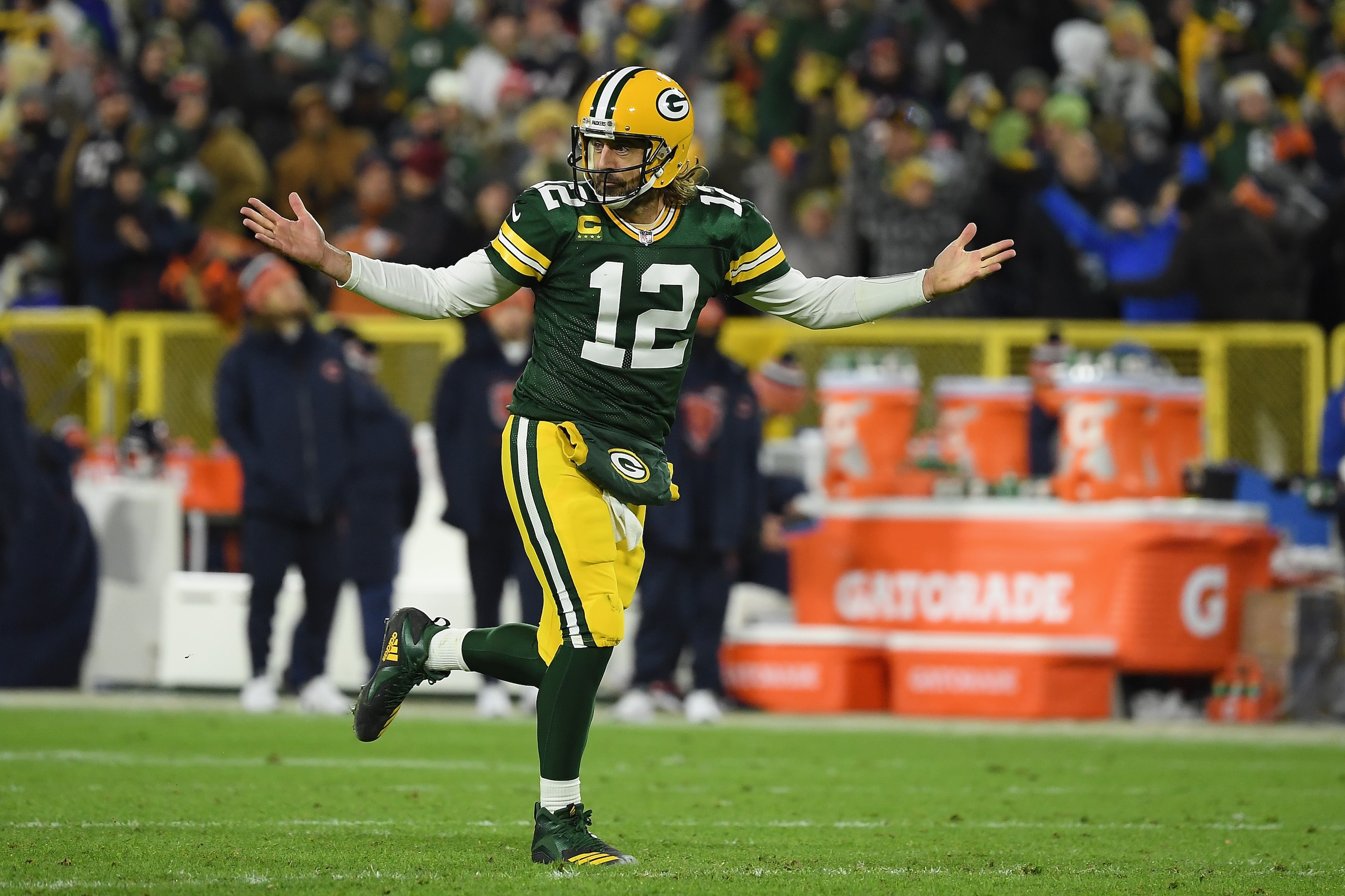 GREEN BAY, WISCONSIN - DECEMBER 12: Aaron Rodgers #12 of the Green Bay Packers reacts after a touchdown pass during the third quarter of the NFL game against the Chicago Bears at Lambeau Field on December 12, 2021 in Green Bay, Wisconsin. (Photo by Quinn Harris/Getty Images)