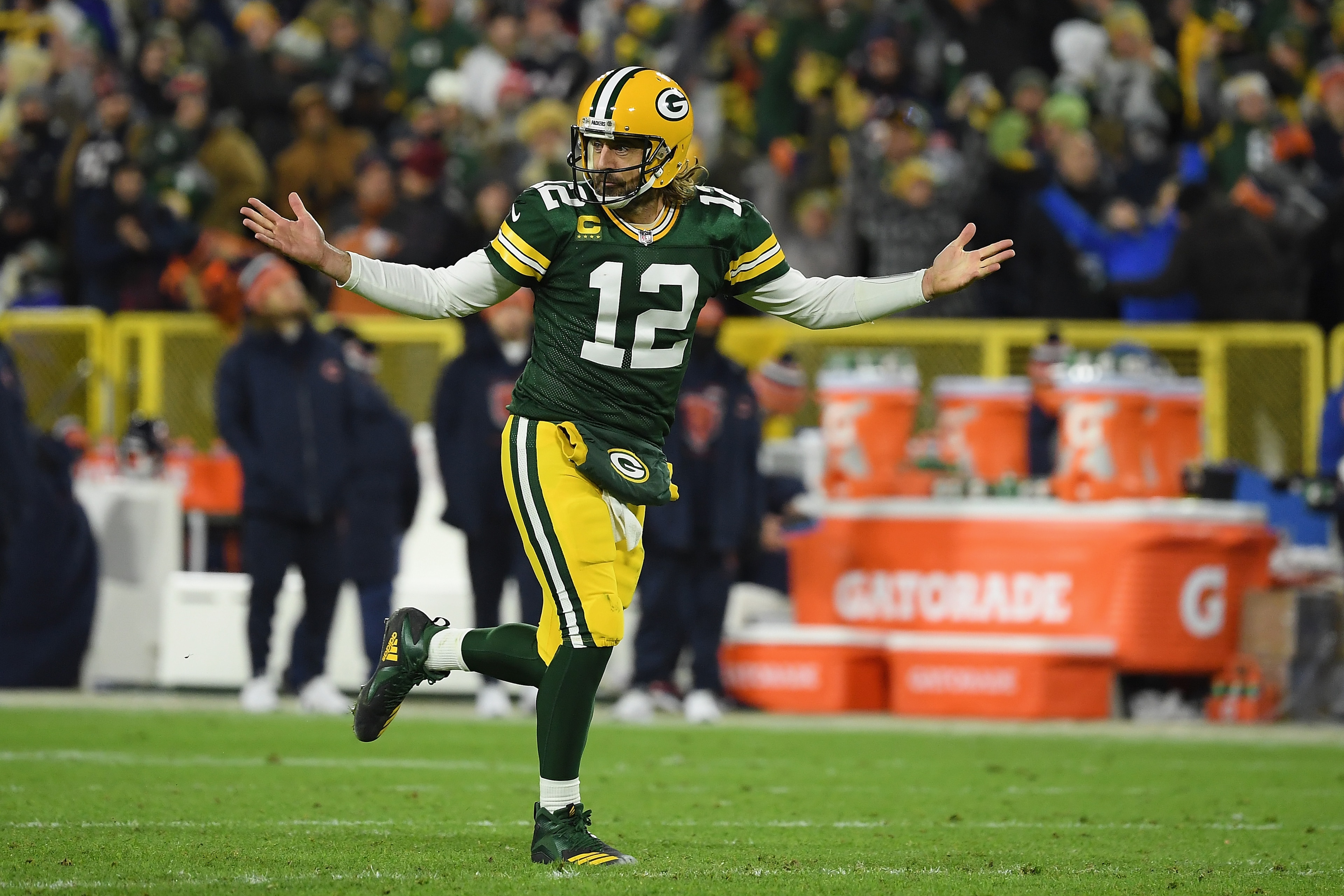GREEN BAY, WISCONSIN - DECEMBER 12: Aaron Rodgers #12 of the Green Bay Packers reacts after a touchdown pass during the third quarter of the NFL game against the Chicago Bears at Lambeau Field on December 12, 2021 in Green Bay, Wisconsin. (Photo by Quinn Harris/Getty Images)