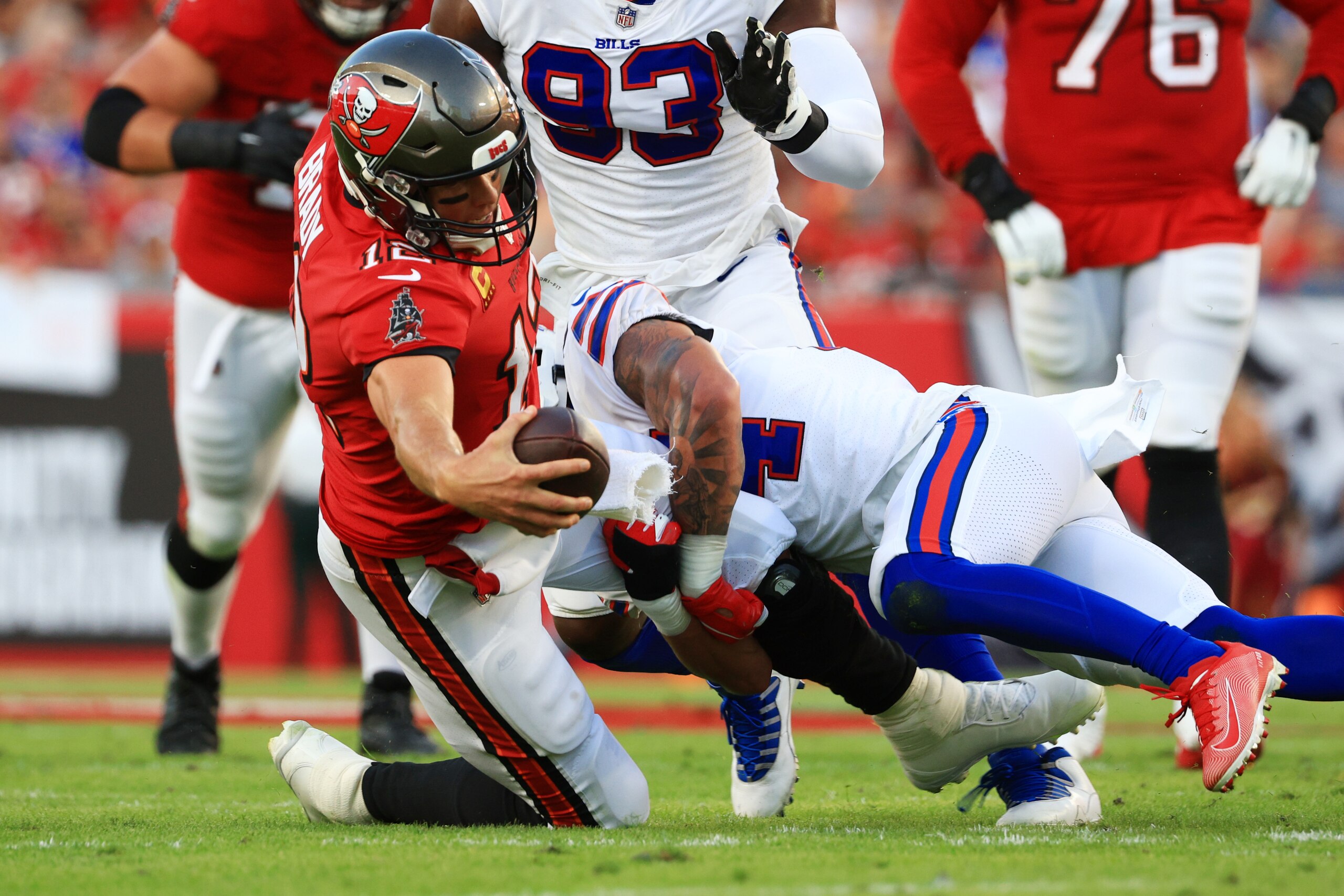TAMPA, FLORIDA - DECEMBER 12: Tom Brady #12 of the Tampa Bay Buccaneers stretches for a first down against the Buffalo Bills during the first quarter at Raymond James Stadium on December 12, 2021 in Tampa, Florida. (Photo by Mike Ehrmann/Getty Images)