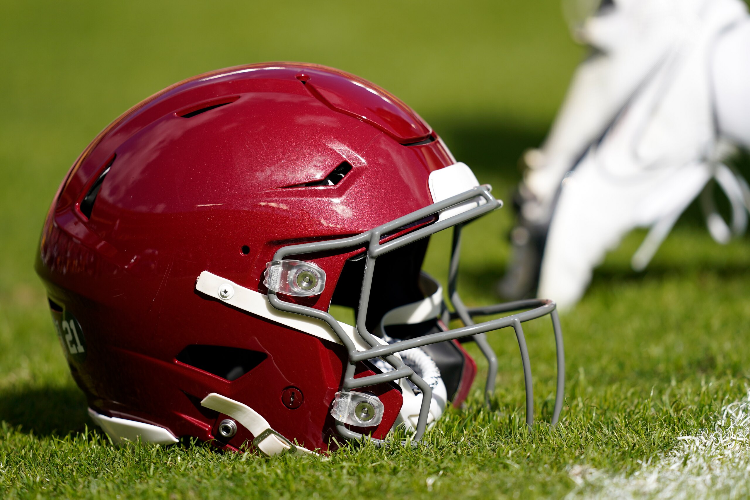 Washington Football Team helmet sits on the field prior to an NFL football game between the Kansas City Chiefs and the Washington Football Team, Sunday, Oct. 17, 2021, in Landover, Md. (AP Photo/Mark Tenally)