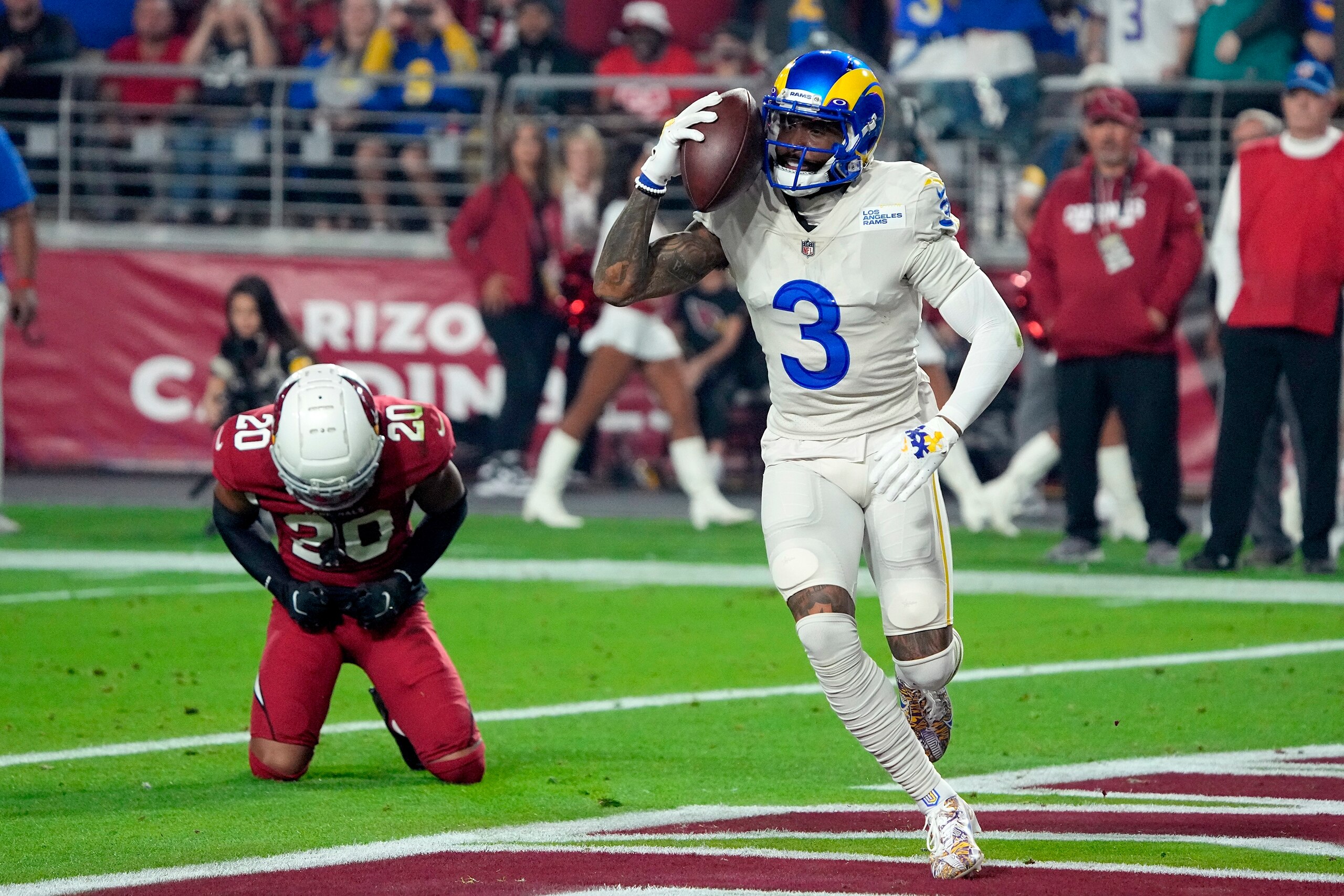 Los Angeles Rams wide receiver Odell Beckham Jr. (3) celebrates his touchdown catch against Arizona Cardinals cornerback Marco Wilson (20) during the first half of an NFL football game Monday, Dec. 13, 2021, in Glendale, Ariz. (AP Photo/Rick Scuteri)