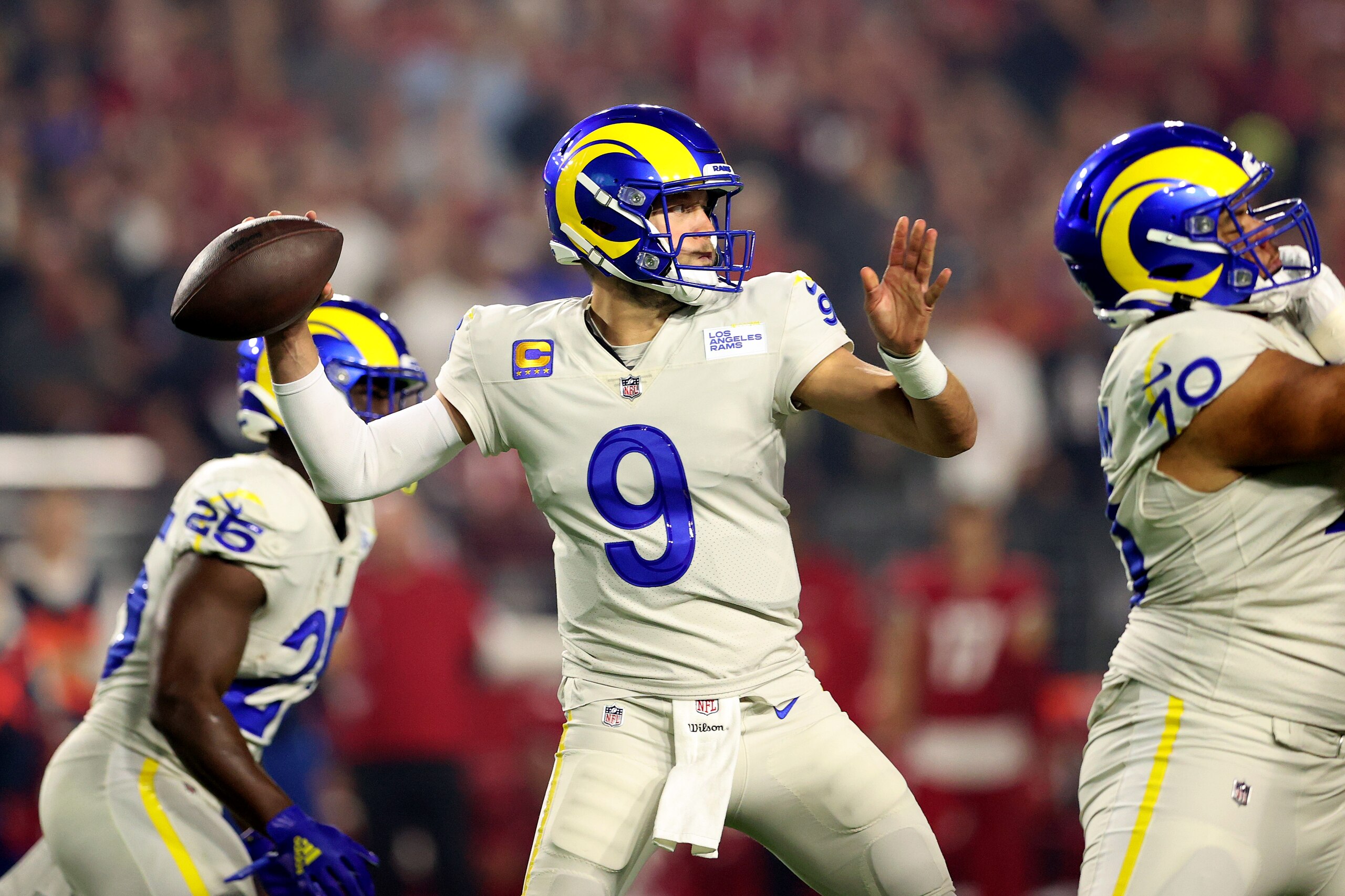 GLENDALE, ARIZONA - DECEMBER 13: Matthew Stafford #9 of the Los Angeles Rams throws the ball in the first quarter of the game against the Arizona Cardinals at State Farm Stadium on December 13, 2021 in Glendale, Arizona. (Photo by Christian Petersen/Getty Images)