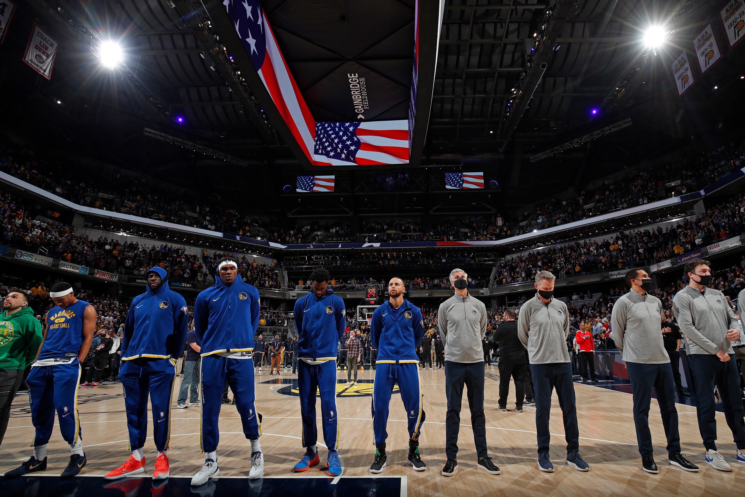 INDIANAPOLIS, IN - DECEMBER 13: Stephen Curry #30 and the Golden State Warriors stand on the court for the National Anthem before the game against the Indiana Pacers on December 13, 2021 at Gainbridge Fieldhouse in Indianapolis, Indiana. NOTE TO USER: User expressly acknowledges and agrees that, by downloading and or using this Photograph, user is consenting to the terms and conditions of the Getty Images License Agreement. Mandatory Copyright Notice: Copyright 2021 NBAE (Photo by Jeff Haynes/NBAE via Getty Images)