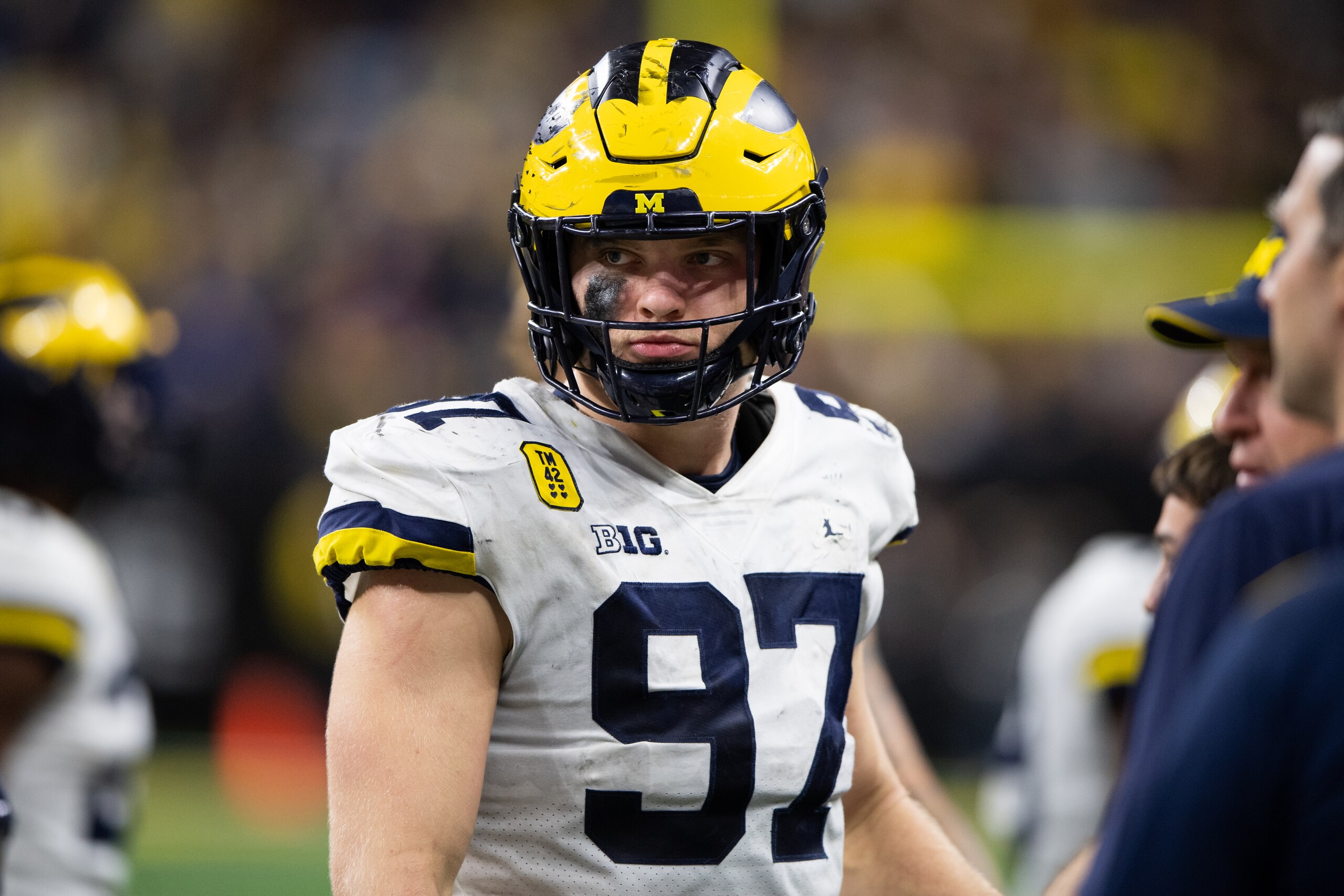 INDIANAPOLIS, IN - DECEMBER 04: Michigan Wolverines defensive end Aidan Hutchinson (97) walks on the sidelines during the Big 10 Championship game between the Michigan Wolverines and Iowa Hawkeyes on December 4, 2021, at Lucas Oil Stadium in Indianapolis, IN. (Photo by Zach Bolinger/Icon Sportswire via Getty Images)