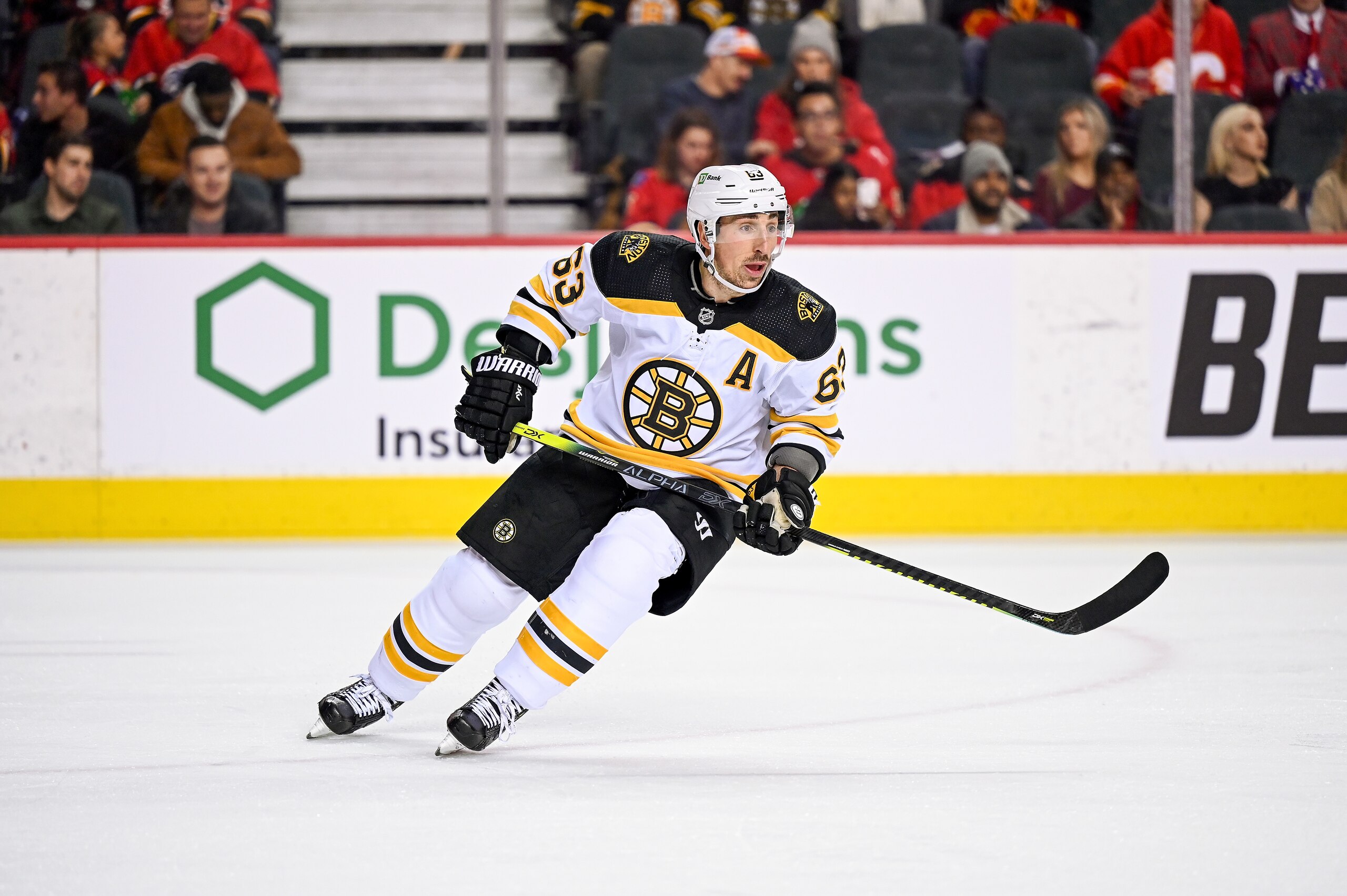 CALGARY, AB - DECEMBER 11: Boston Bruins Left Wing Brad Marchand (63) skates during the first period of an NHL game where the Calgary Flames hosted the Boston Bruins on December 11, 2021, at the Scotiabank Saddledome in Calgary, AB. (Photo by Brett Holmes/Icon Sportswire via Getty Images)