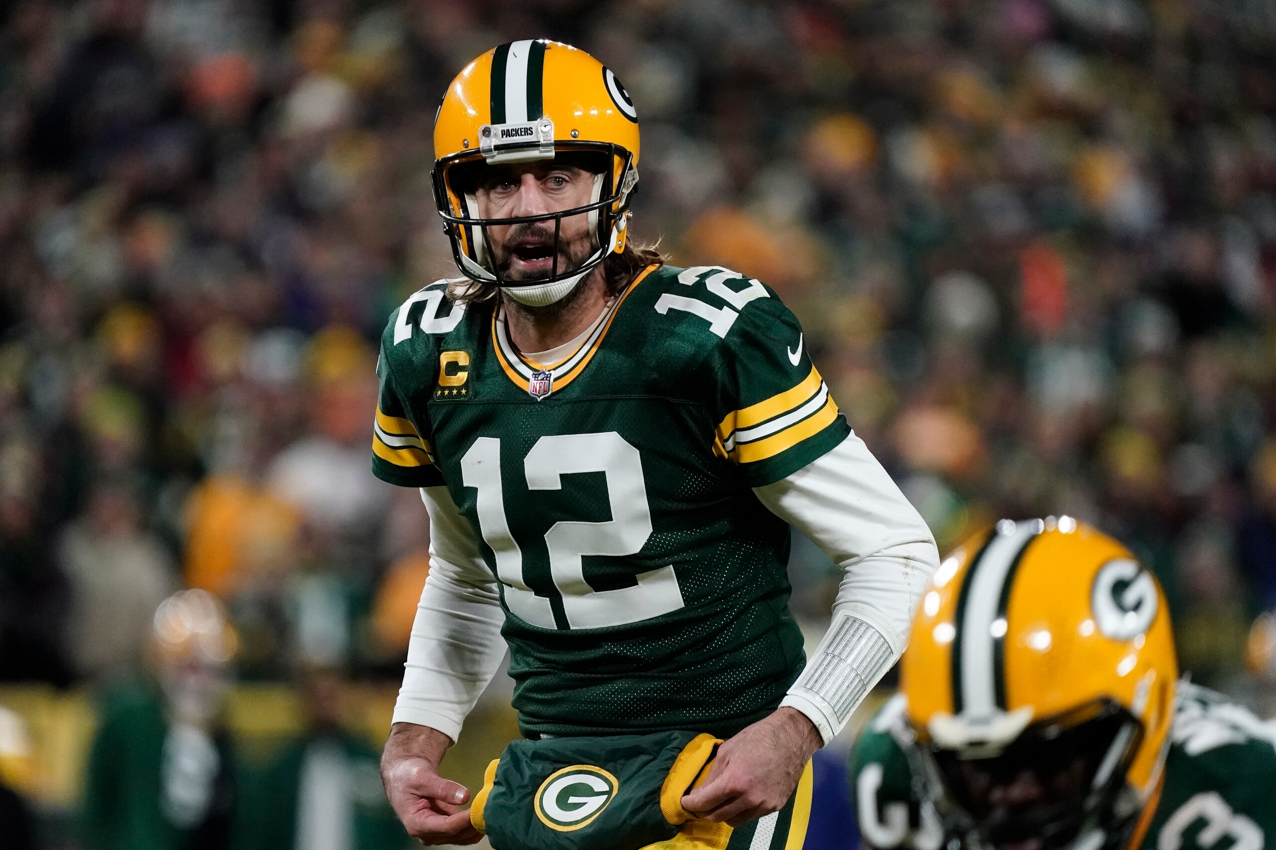 Green Bay Packers' Aaron Rodgers takes a snap during the second half of an NFL football game against the Chicago Bears Sunday, Dec. 12, 2021, in Green Bay, Wis. (AP Photo/Morry Gash)