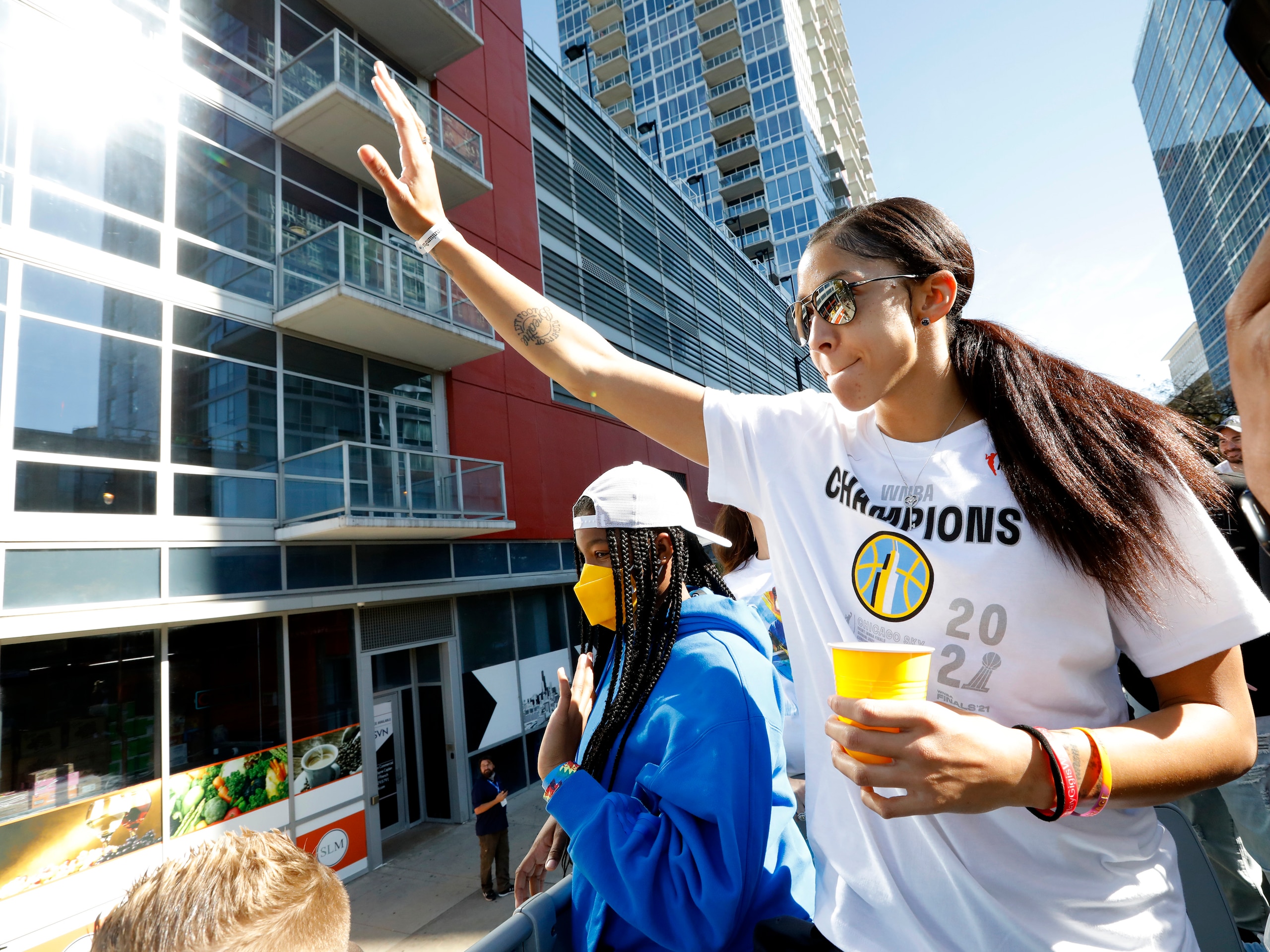 CHICAGO, IL - OCTOBER 19:  Candace Parker #3 of the Chicago Sky waves to fans during the 2021 Chicago Sky Championship Parade on October 19, 2021 in Chicago, Illinois. NOTE TO USER: User expressly acknowledges and agrees that, by downloading and or using this photograph, user is consenting to the terms and conditions of the Getty Images License Agreement.  Mandatory Copyright Notice: Copyright 2021 NBAE (Photo by Kena Krutsinger/NBAE via Getty Images)