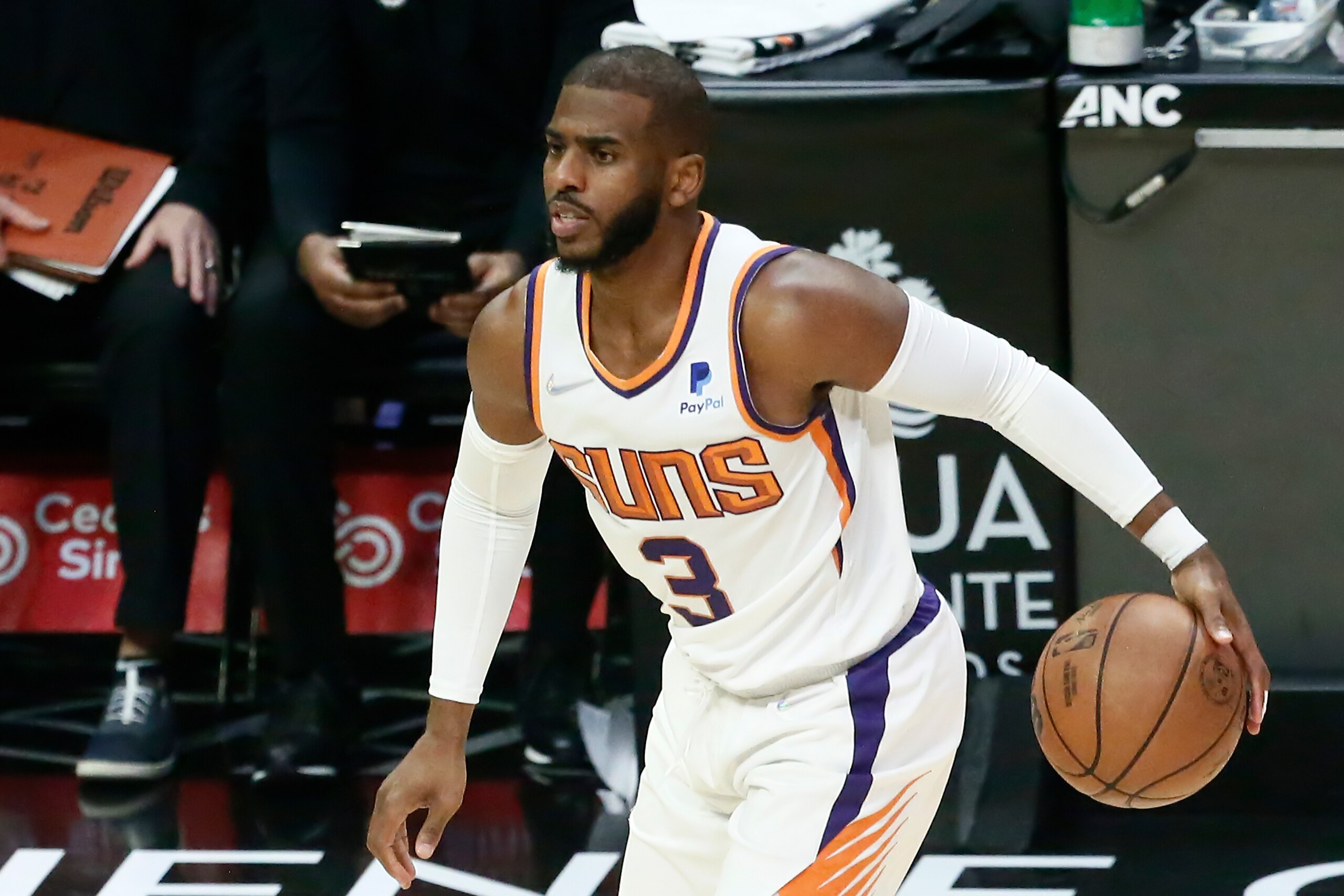 LOS ANGELES, CA - DECEMBER 13: Chris Paul #3 of the Phoenix Suns dribbles the ball during a game at the STAPLES Center on December 13, 2021 in Los Angeles, California. NOTE TO USER: User expressly acknowledges and agrees that, by downloading and or using this photograph, User is consenting to the terms and conditions of the Getty Images License Agreement. Mandatory Credit: 2021 NBAE (Photo by Chris Elise/NBAE via Getty Images)