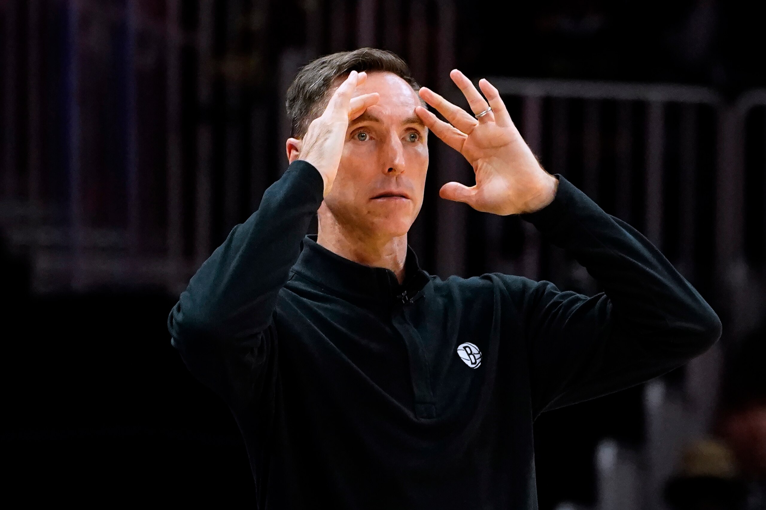 Brooklyn Nets coach Steve Nash watches from the bench during the first half of the team's NBA basketball game against the Atlanta Hawks on Friday, Dec. 10, 2021, in Atlanta. (AP Photo/John Bazemore)