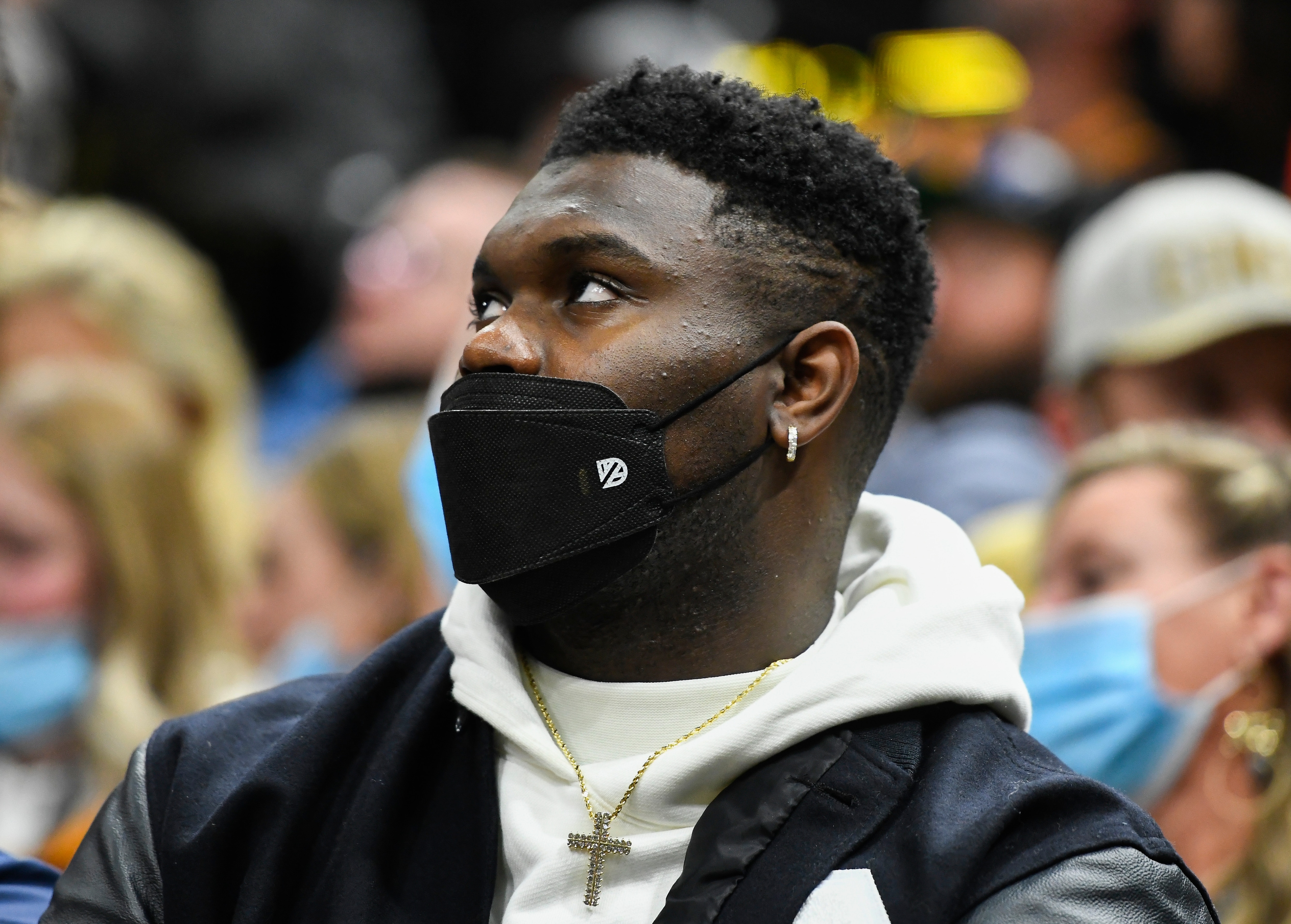 New Orleans Pelicans forward Zion Williamson sits behind his team's bench during the first half of an NBA basketball game against the Utah Jazz, Friday, Nov. 26, 2021, in Salt Lake City. (AP Photo/Alex Goodlett)