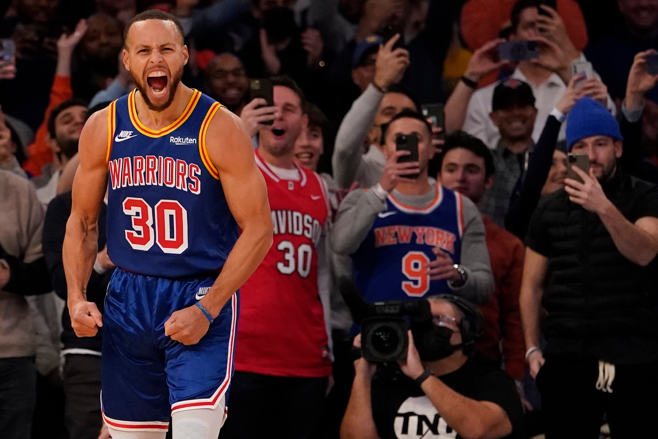 Golden State Warriors guard Stephen Curry reacts after scoring a 3-point basket during the first half of an NBA basketball game against the New York Knicks, Tuesday, Dec. 14, 2021, at Madison Square Garden in New York. Curry hit his 2,974th 3-pointer Tuesday night in the first quarter, breaking the record set by Ray Allen. (AP Photo/Mary Altaffer)