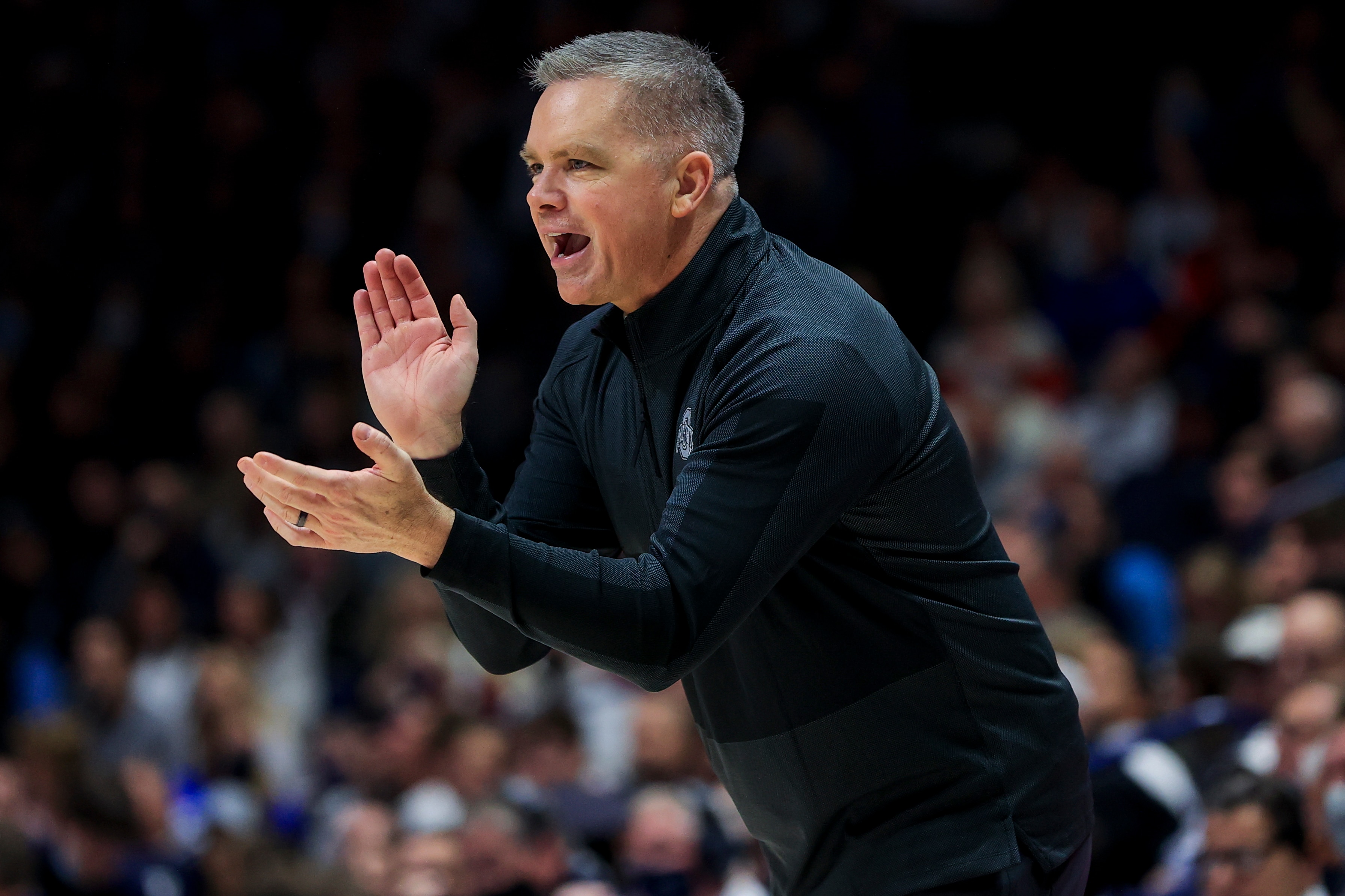 Ohio State's head coach Chris Holtmann reacts from the bench during an NCAA college basketball game against Xavier, Thursday, Nov. 18, 2021, in Cincinnati. Xavier won 71-65. (AP Photo/Aaron Doster)