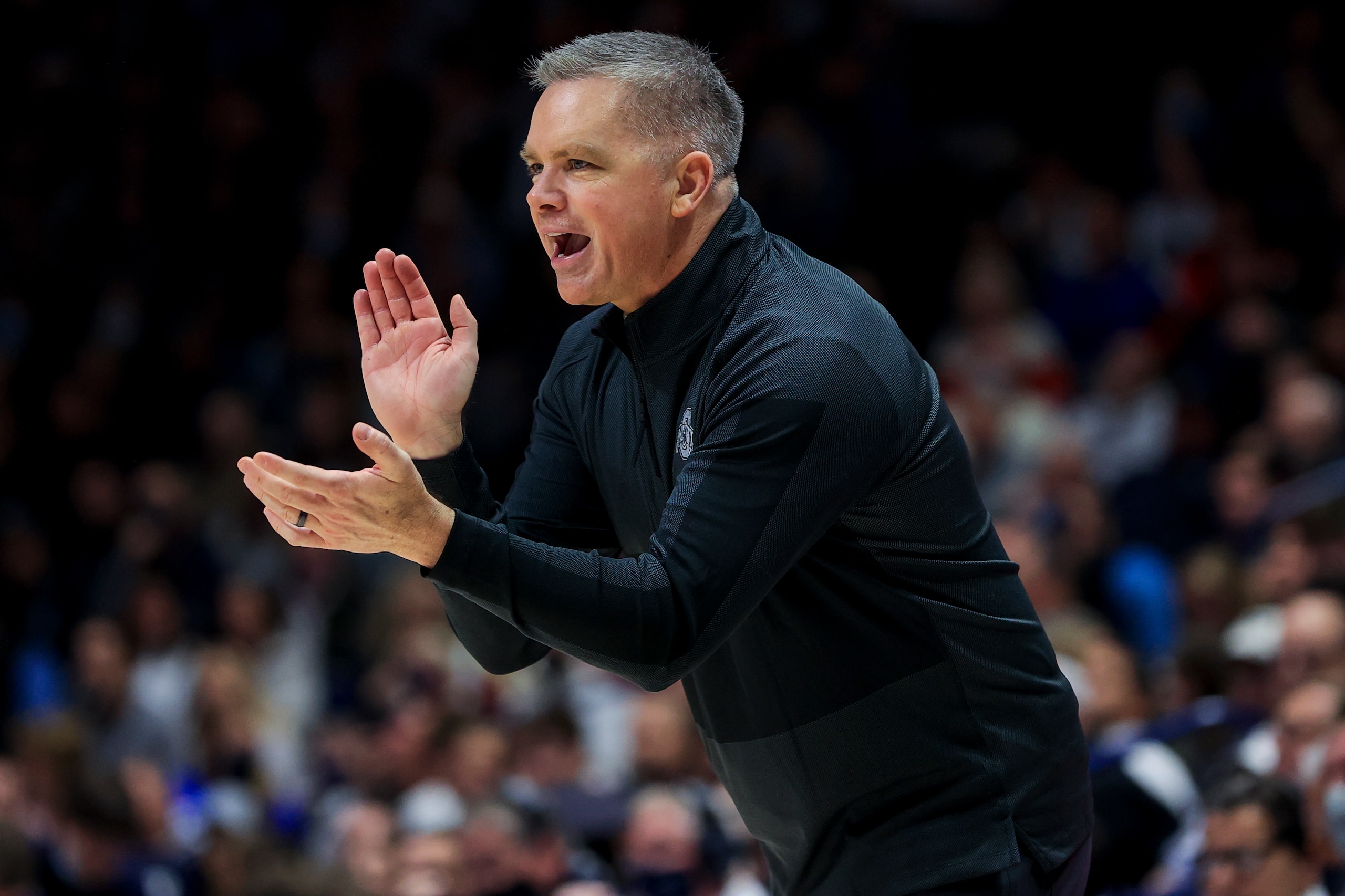 Ohio State's head coach Chris Holtmann reacts from the bench during an NCAA college basketball game against Xavier, Thursday, Nov. 18, 2021, in Cincinnati. Xavier won 71-65. (AP Photo/Aaron Doster) Ohio State's head coach Chris Holtmann reacts from the bench during an NCAA college basketball game against Xavier, Thursday, Nov. 18, 2021, in Cincinnati. Xavier won 71-65. (AP Photo/Aaron Doster)