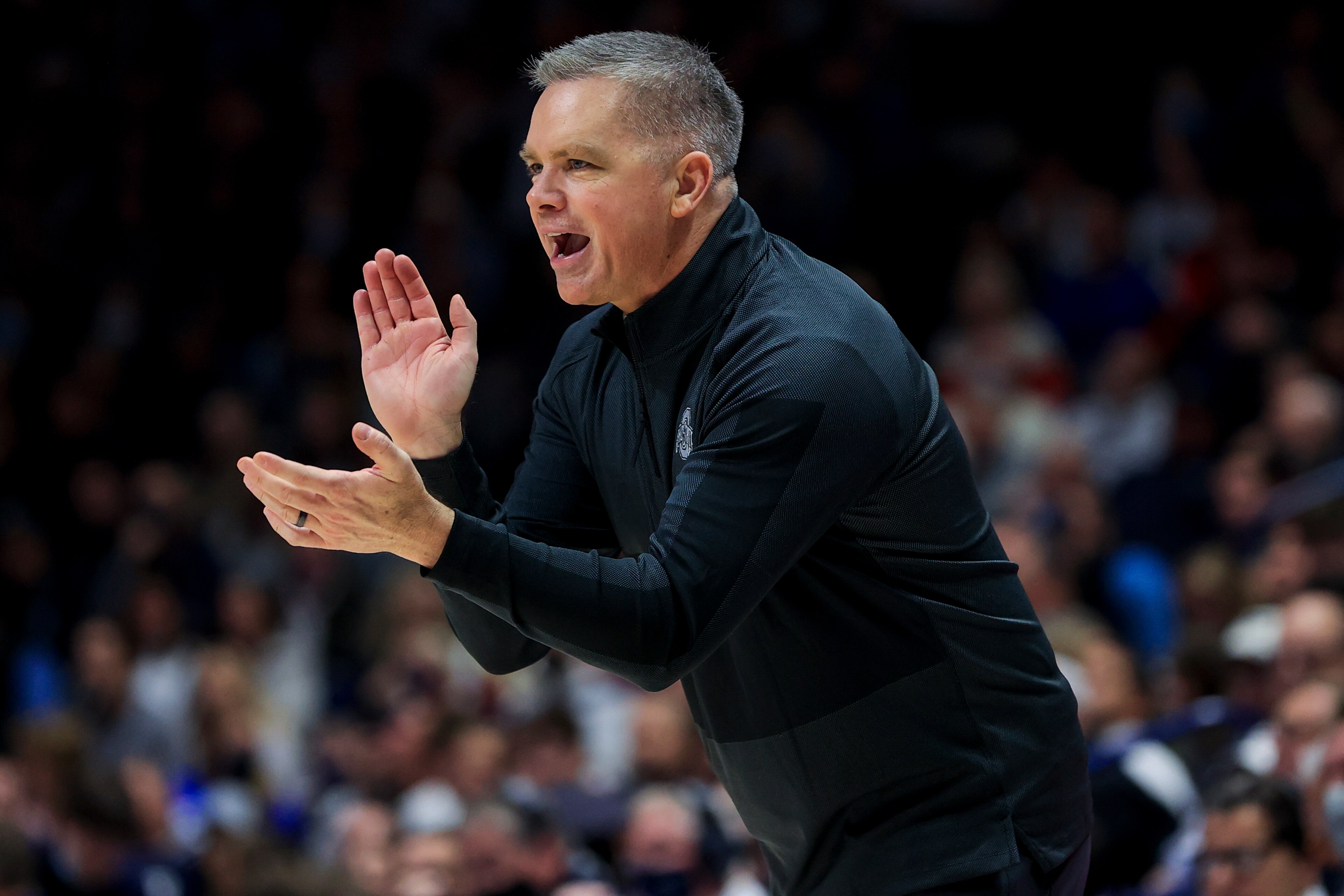 Ohio State's head coach Chris Holtmann reacts from the bench during an NCAA college basketball game against Xavier, Thursday, Nov. 18, 2021, in Cincinnati. Xavier won 71-65. (AP Photo/Aaron Doster)