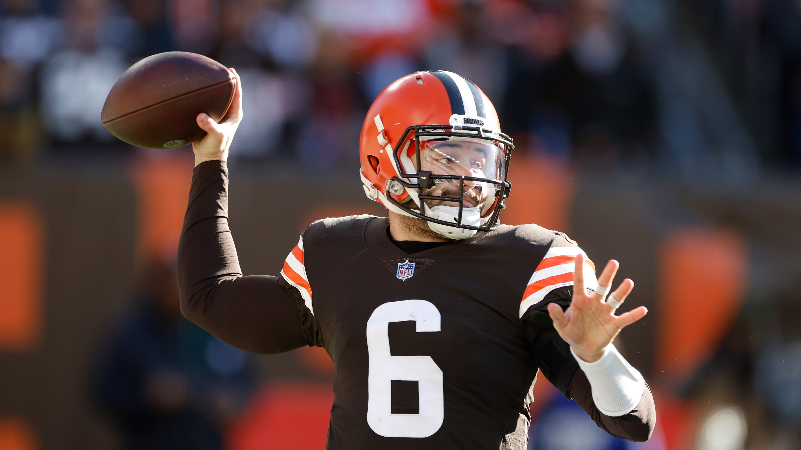 Cleveland Browns quarterback Baker Mayfield throws during the first half of an NFL football game against the Baltimore Ravens, Sunday, Dec. 12, 2021, in Cleveland. (AP Photo/Ron Schwane)