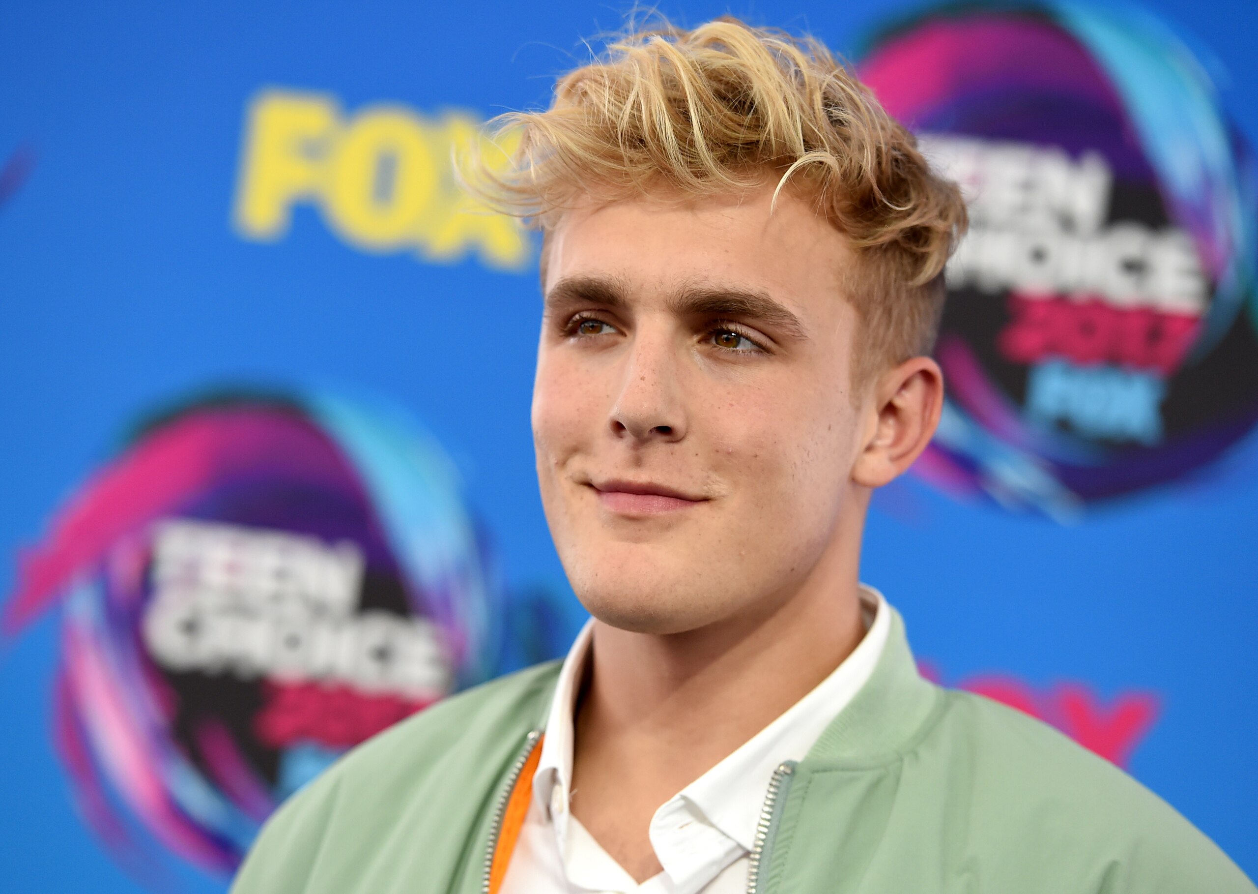 FILE - Internet personality Jake Paul arrives at the Teen Choice Awards in Los Angeles on Aug. 13, 2017. FBI agents including a SWAT team have raided the apparent home of YouTube star Jake Paul. FBI spokeswoman Laura Eimiller says agents executed a search warrant Wednesday at the Calabasas, California mansion in connection with an ongoing investigation. She could not say what the probe is about or who the target was. Helicopter video from local TV news showed agents gathering guns from the home that can frequently be seen on Paul's YouTube channel, which has over 20 million followers. (Photo by Jordan Strauss/Invision/AP, File) FILE - Internet personality Jake Paul arrives at the Teen Choice Awards in Los Angeles on Aug. 13, 2017. FBI agents including a SWAT team have raided the apparent home of YouTube star Jake Paul. FBI spokeswoman Laura Eimiller says agents executed a search warrant Wednesday at the Calabasas, California mansion in connection with an ongoing investigation. She could not say what the probe is about or who the target was. Helicopter video from local TV news showed agents gathering guns from the home that can frequently be seen on Paul's YouTube channel, which has over 20 million followers. (Photo by Jordan Strauss/Invision/AP, File)