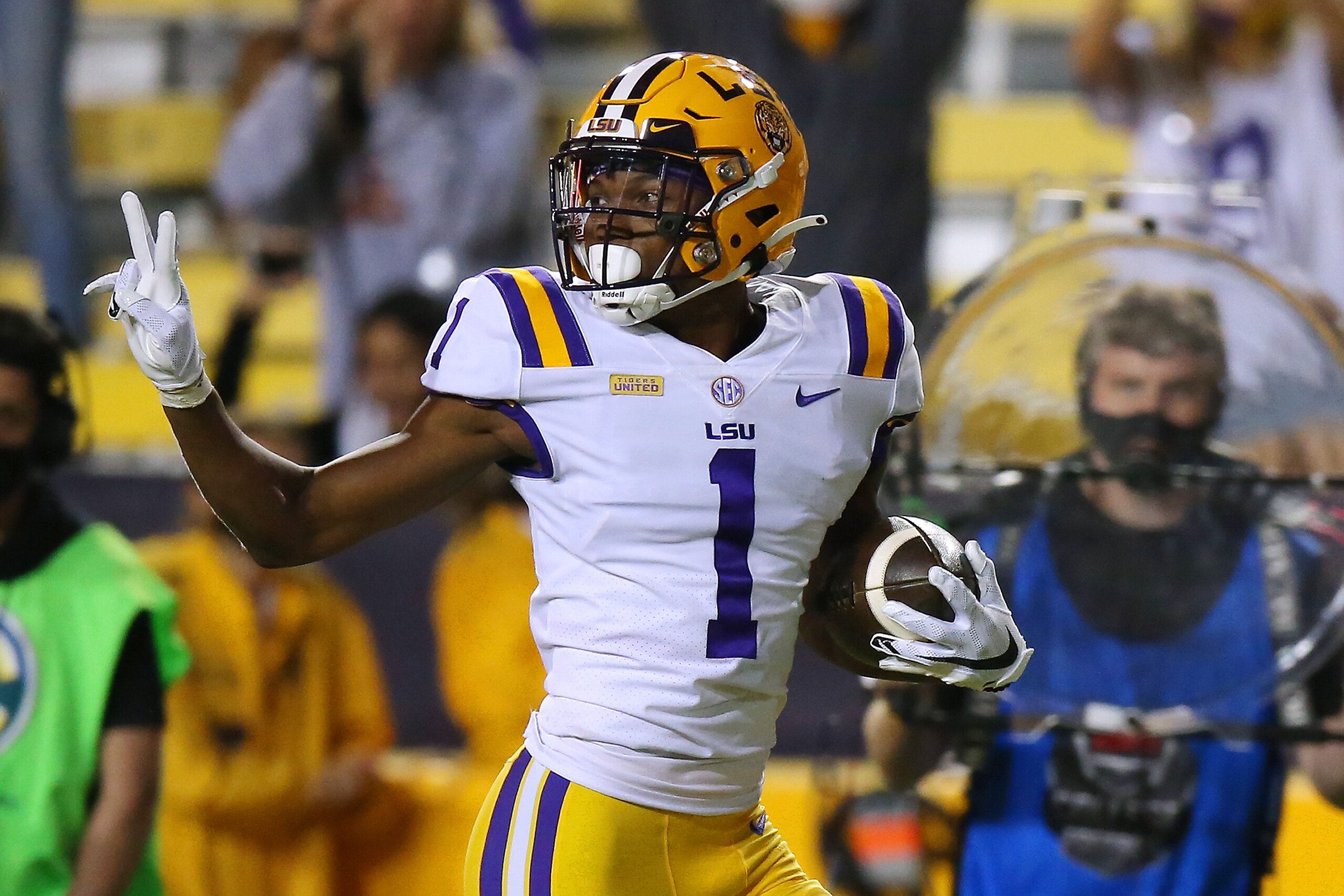 BATON ROUGE, LOUISIANA - OCTOBER 24: Eli Ricks #1 of the LSU Tigers gestures while scoring a touchdown on an interception during a game against the South Carolina Gamecocks at Tiger Stadium on October 24, 2020 in Baton Rouge, Louisiana. (Photo by Jonathan Bachman/Getty Images)
