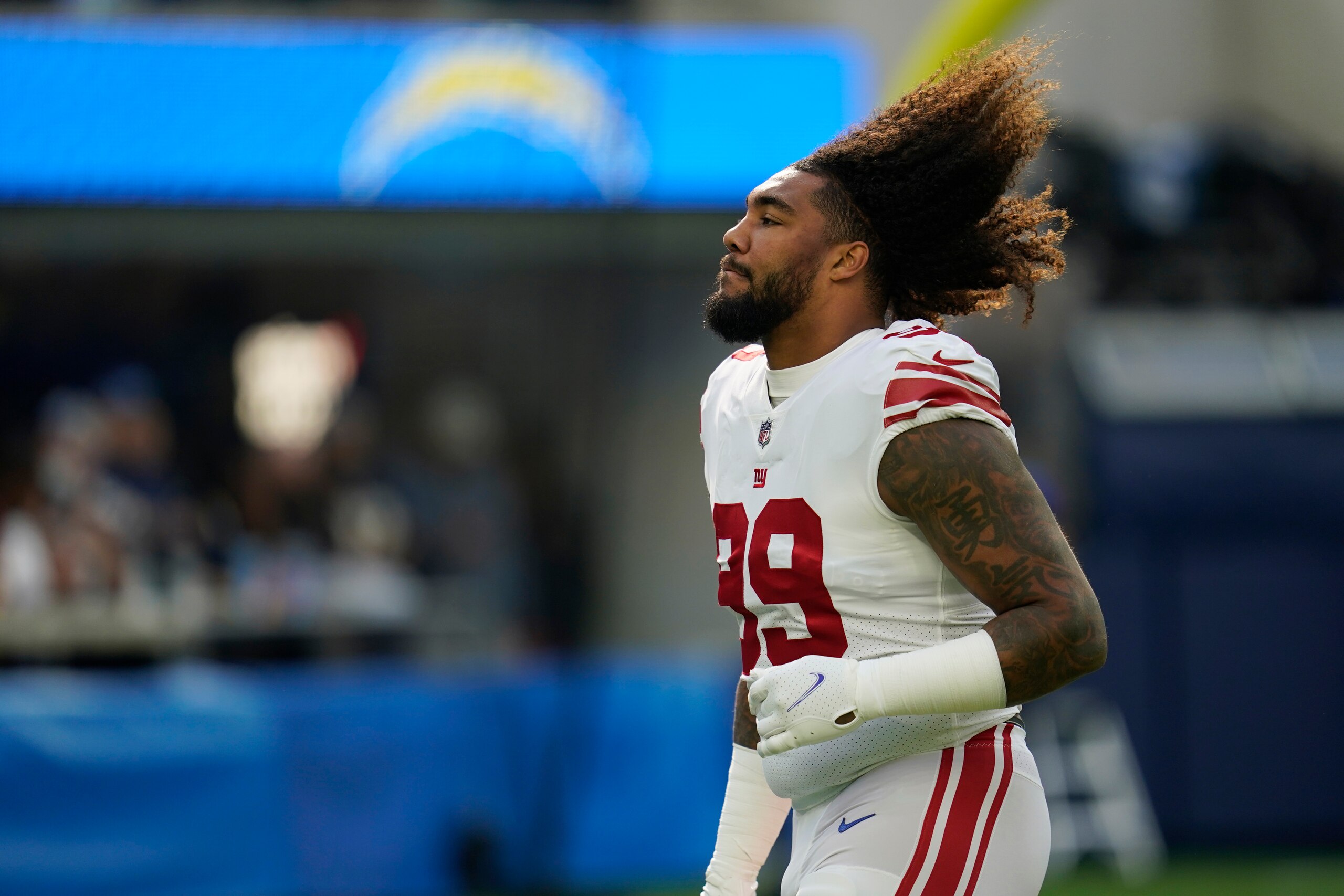 New York Giants defensive end Leonard Williams (99) runs during warm ups before an NFL football game against the Los Angeles Chargers Sunday, Dec. 12, 2021, in Inglewood, Calif. (AP Photo/Ashley Landis)