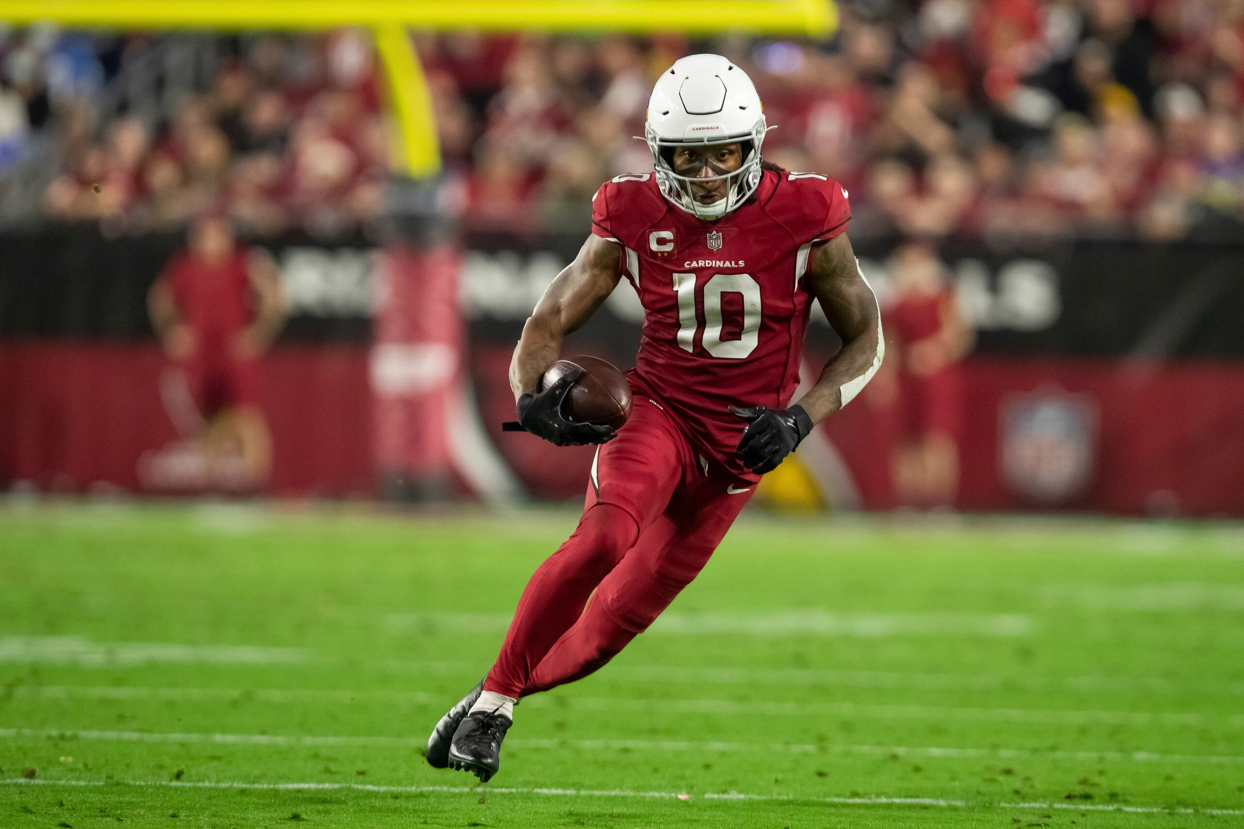Wide receiver (10) DeAndre Hopkins of the Arizona Cardinals catches a pass and runs against the Los Angeles Rams in an NFL football game, Monday, Dec. 13, 2021, in Glendale, AZ. The Rams defeated the Cardinals 30-23. (AP Photo/Jeff Lewis)