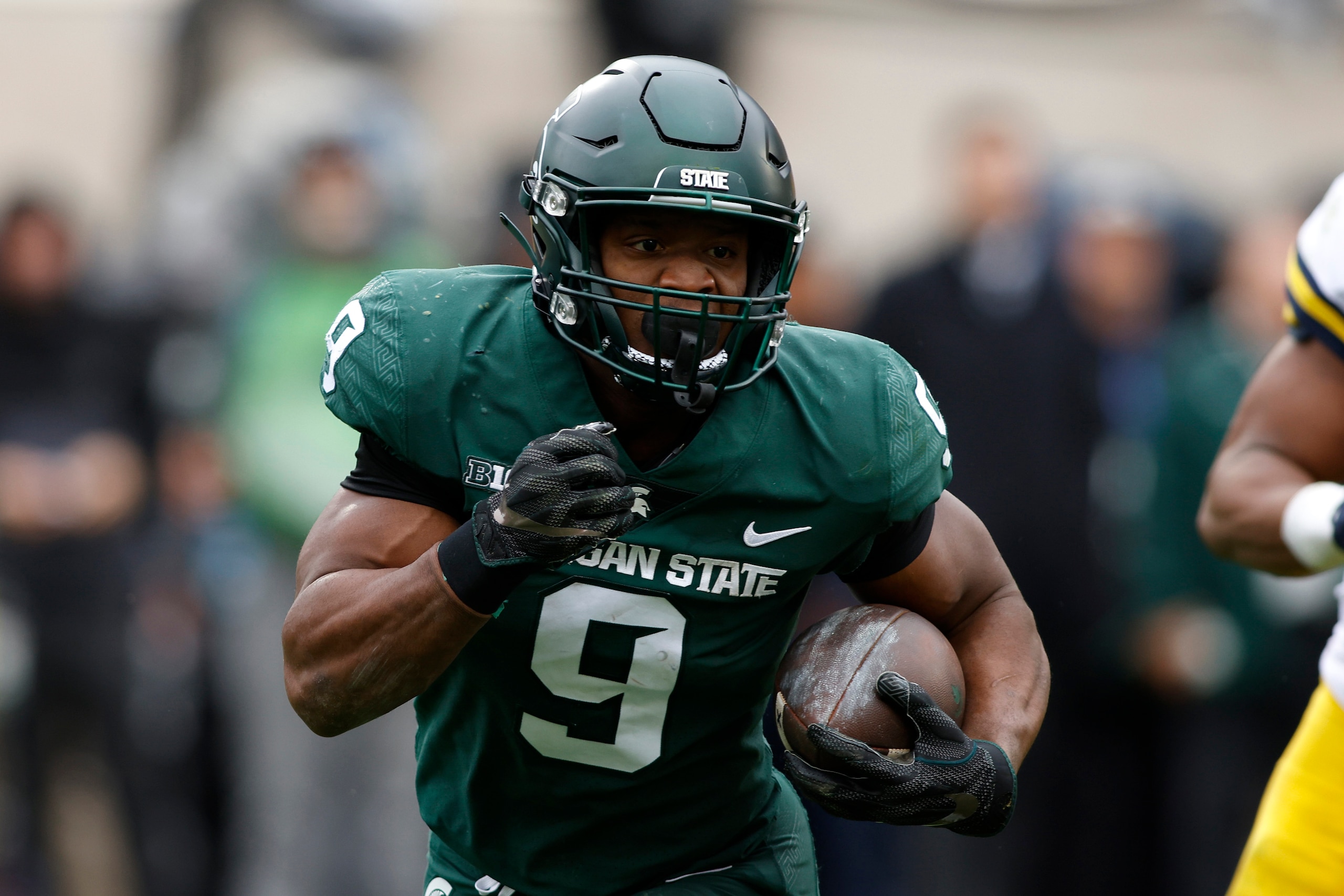 Michigan State's Kenneth Walker III runs against Michigan during an NCAA college football game, Saturday, Oct. 30, 2021, in East Lansing, Mich. (AP Photo/Al Goldis)