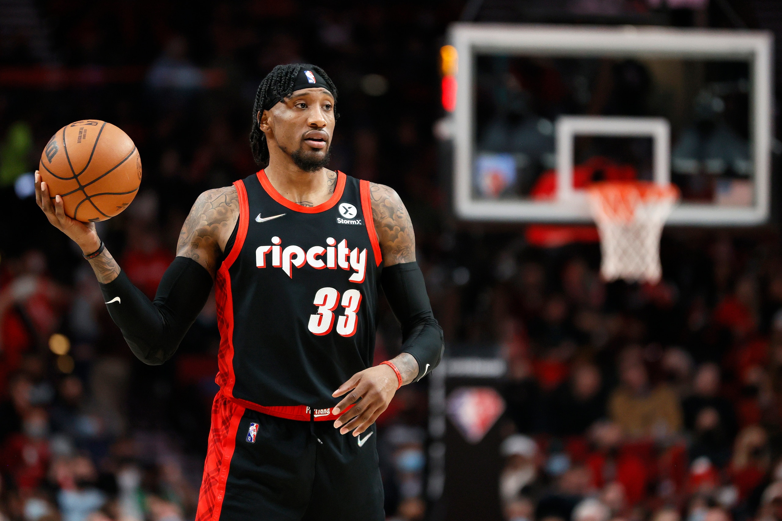PORTLAND, OREGON - DECEMBER 14: Robert Covington #33 of the Portland Trail Blazers looks to pass against the Phoenix Suns during the first half at Moda Center on December 14, 2021 in Portland, Oregon. NOTE TO USER: User expressly acknowledges and agrees that, by downloading and or using this photograph, User is consenting to the terms and conditions of the Getty Images License Agreement. (Photo by Steph Chambers/Getty Images)