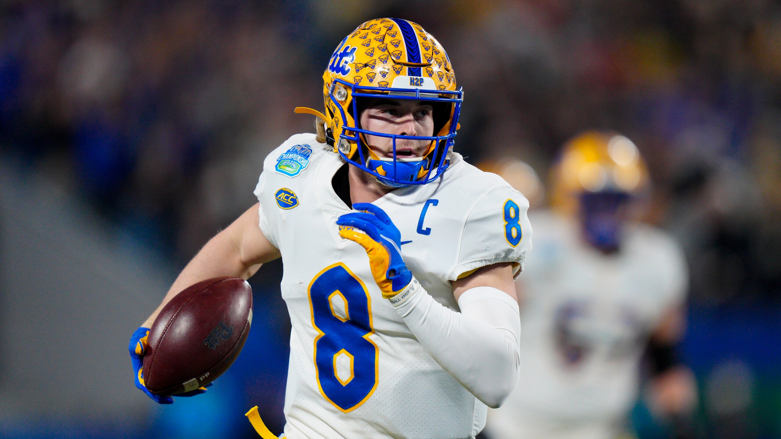 Pittsburgh quarterback Kenny Pickett scores against Wake Forest during the first half of the Atlantic Coast Conference championship NCAA college football game Saturday, Dec. 4, 2021, in Charlotte, N.C. (AP Photo/Jacob Kupferman)