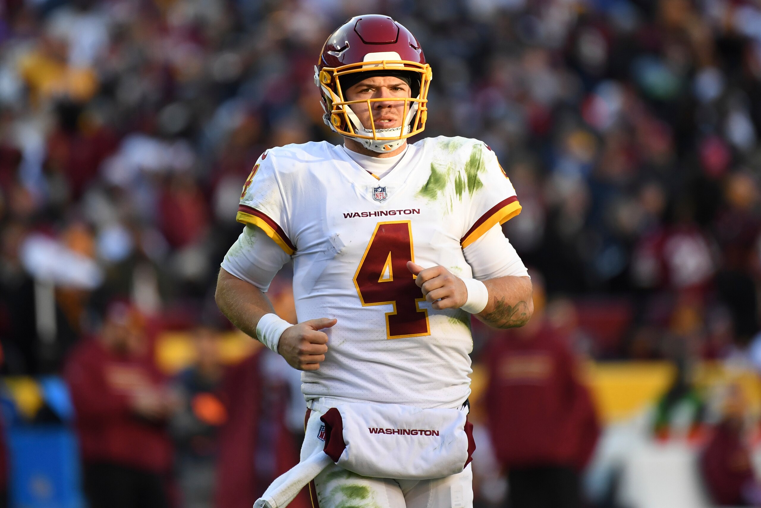 Washington Football Team quarterback Taylor Heinicke (4) jogs on to the field during the second half of an NFL football game against the Dallas Cowboys, Sunday, Dec. 12, 2021, in Landover, Md. (AP Photo/Terrance Williams) Washington Football Team quarterback Taylor Heinicke (4) jogs on to the field during the second half of an NFL football game against the Dallas Cowboys, Sunday, Dec. 12, 2021, in Landover, Md. (AP Photo/Terrance Williams)
