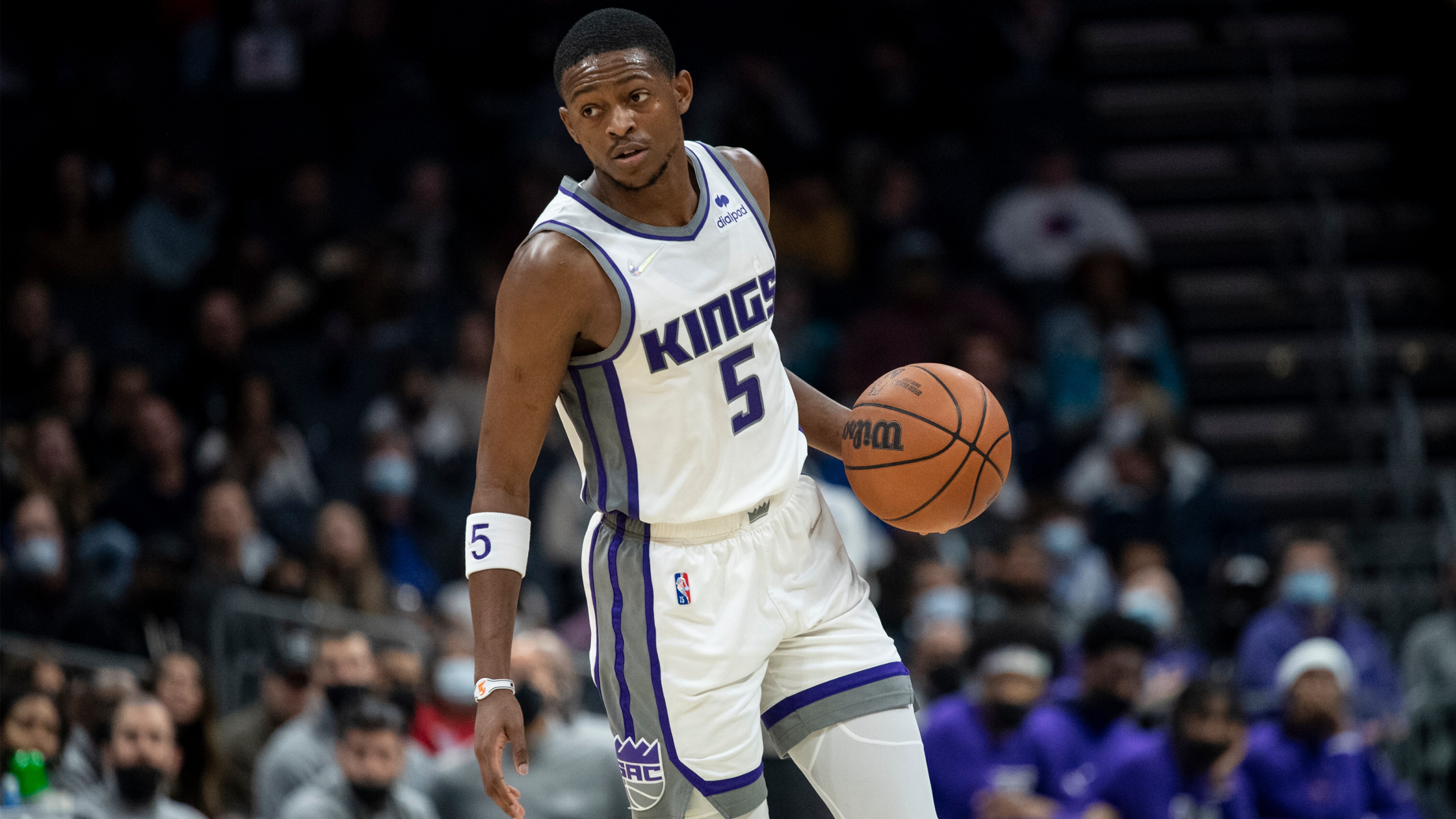 Sacramento Kings guard De'Aaron Fox (5) brings the ball up court during the second half of an NBA basketball game against the Charlotte Hornets, Friday, Dec. 10, 2021, in Charlotte, N.C. (AP Photo/Matt Kelley)