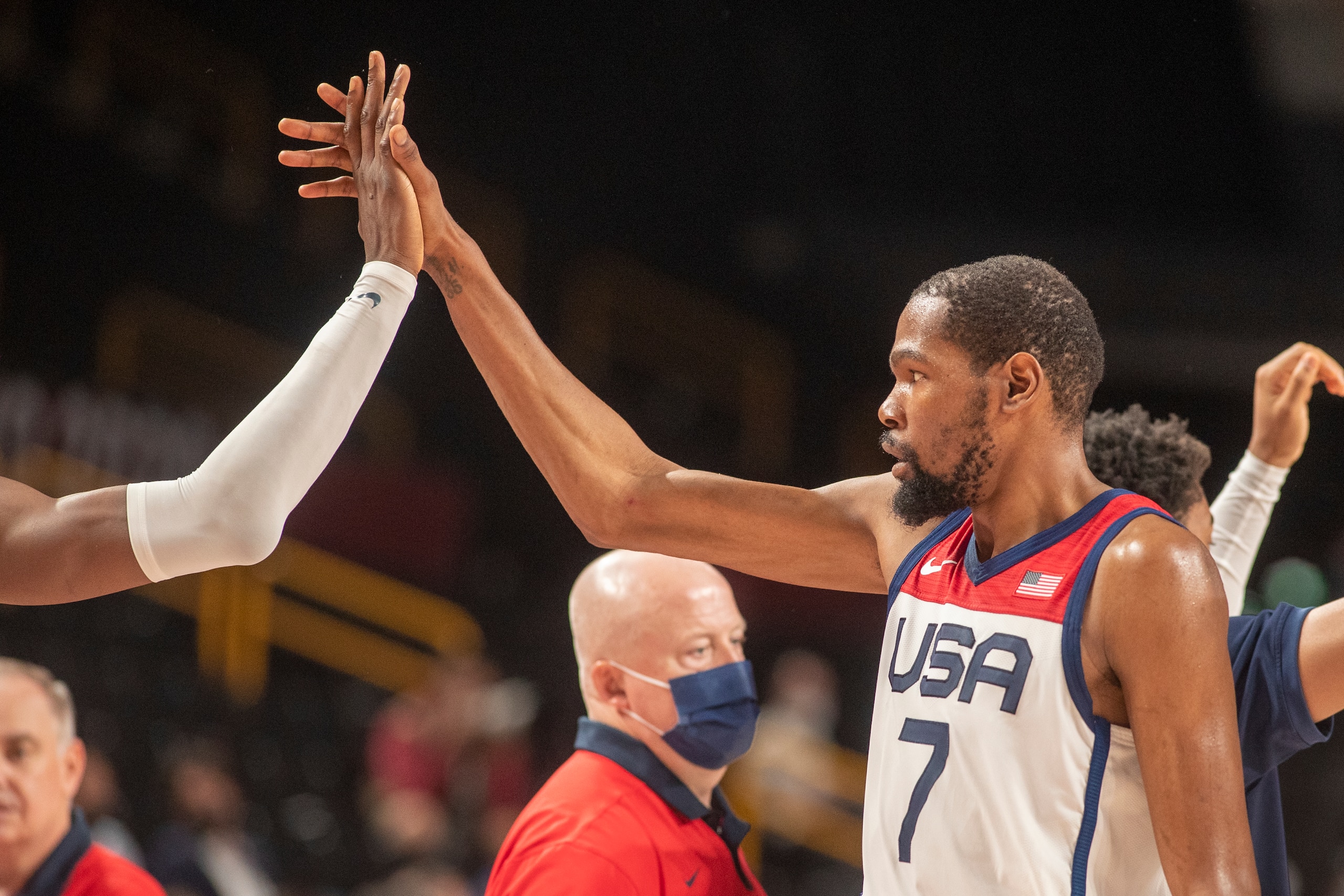 TOKYO, JAPAN August 7:    Kevin Durant #7 of the United States high fees with team mates during the France V USA basketball final for men at the Saitama Super Arena during the Tokyo 2020 Summer Olympic Games on August 7, 2021 in Tokyo, Japan. (Photo by Tim Clayton/Corbis via Getty Images)