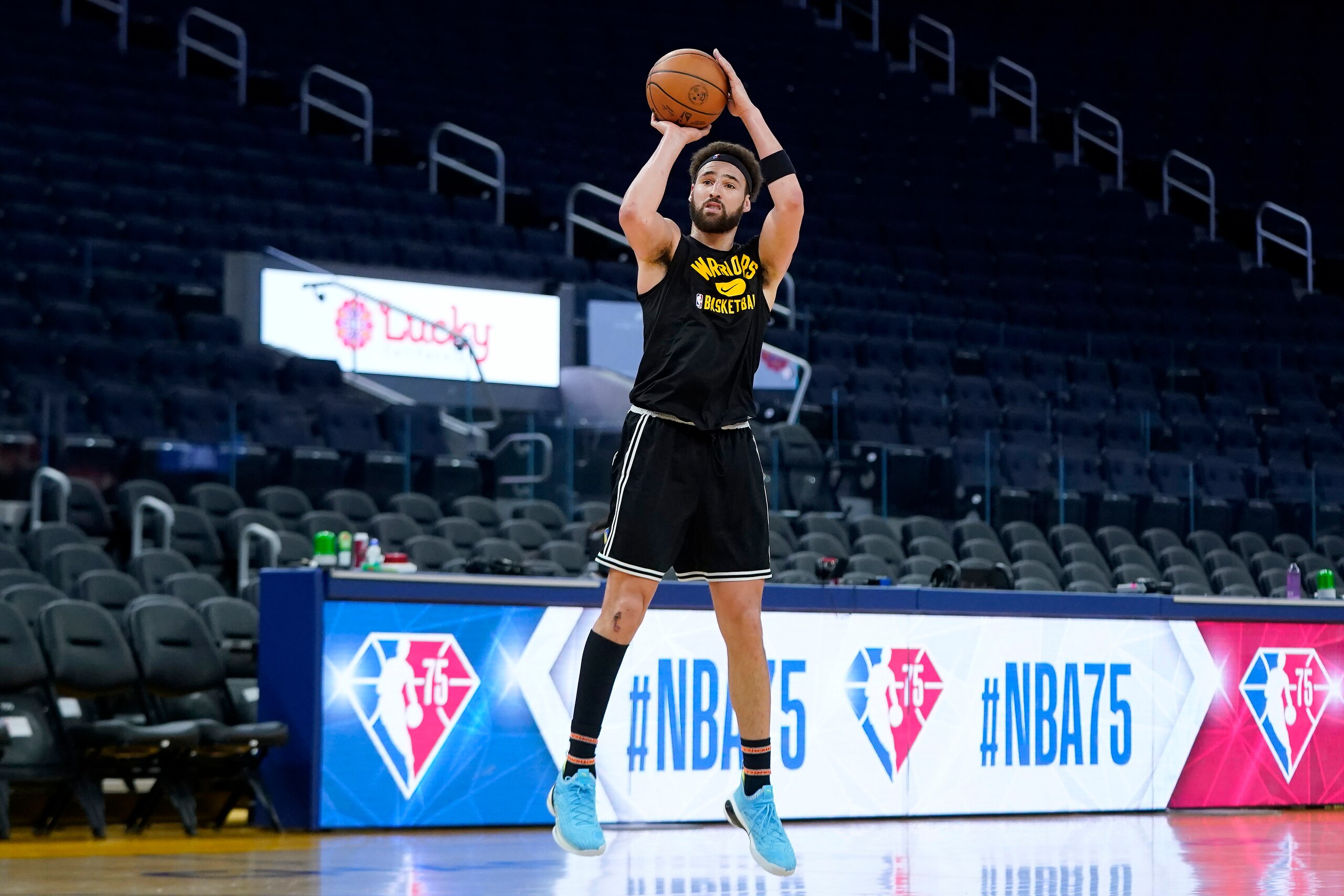 Injured Golden State Warriors guard Klay Thompson shoots before the team's NBA basketball game against the Portland Trail Blazers in San Francisco, Wednesday, Dec. 8, 2021. (AP Photo/Jeff Chiu)