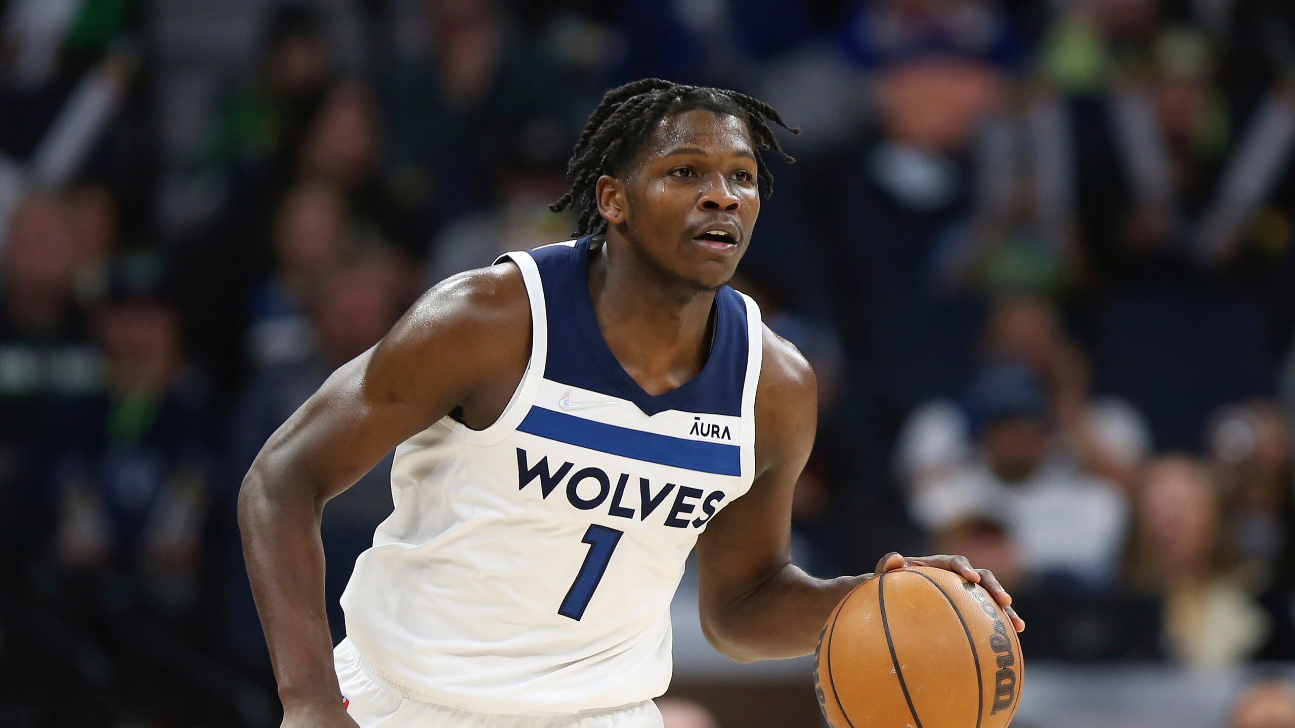 Minnesota Timberwolves forward Anthony Edwards (1) handles the ball during the second half of an NBA basketball game against the Utah Jazz, Wednesday Dec. 8, 2021, in Minneapolis. Utah won 136-104. (AP Photo/Stacy Bengs)