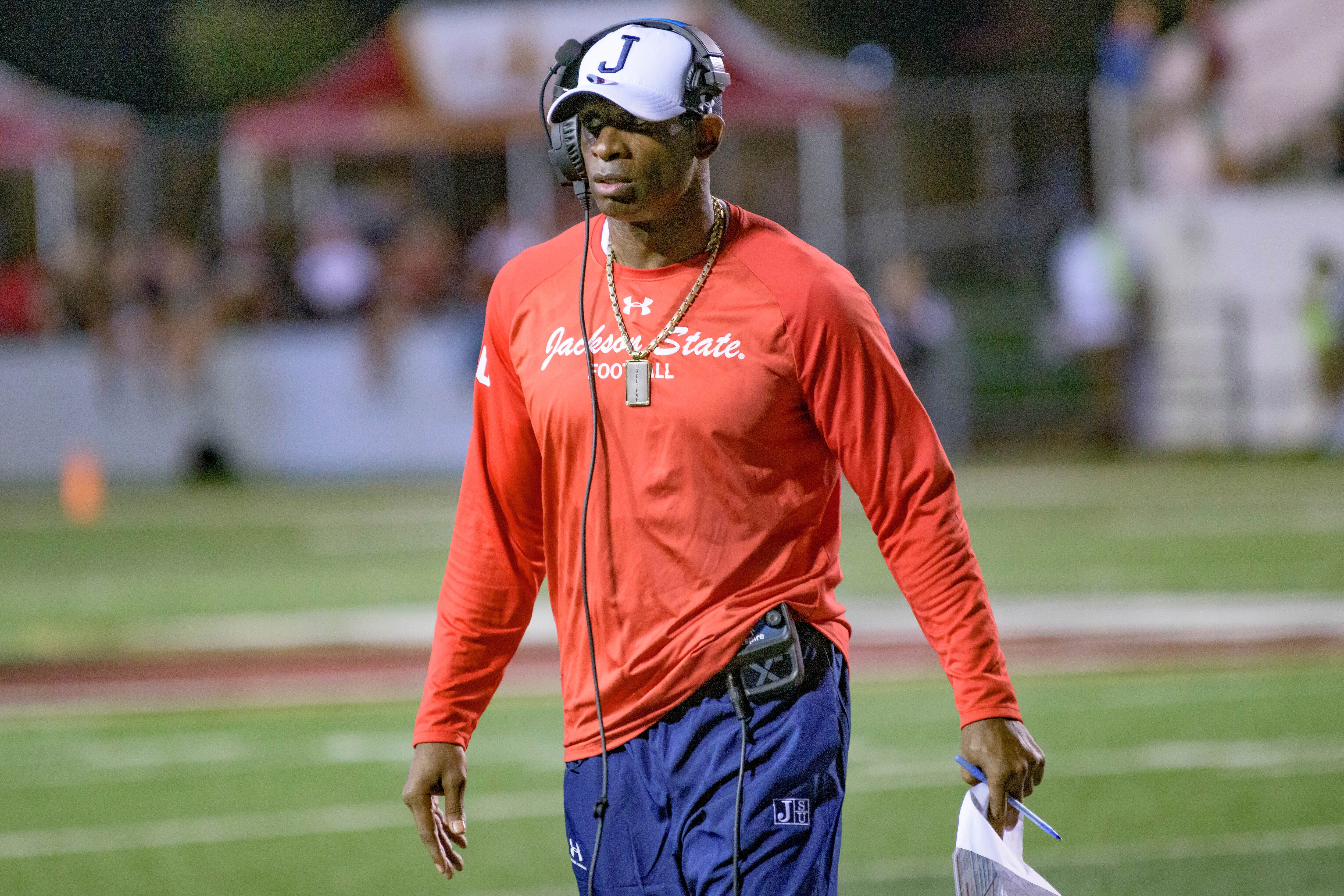 Jackson State head coach Deion Sanders walks the field during an NCAA football game against Louisiana Monroe on Saturday, Sept. 18, 2021, in Monroe, La. (AP Photo/Matthew Hinton)