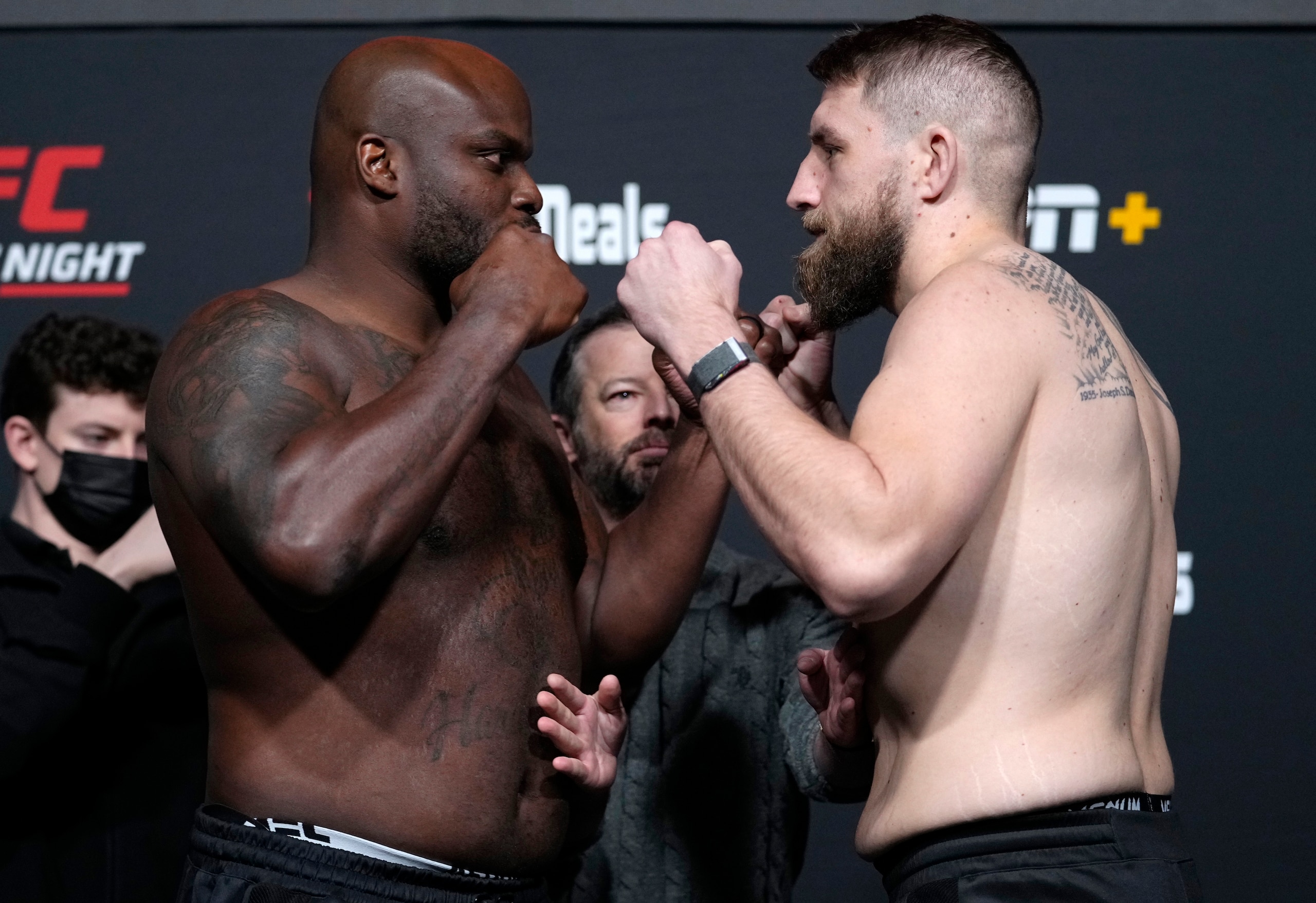 LAS VEGAS, NEVADA - DECEMBER 17:  (L-R) Opponents Derrick Lewis and Chris Daukaus face off during the UFC Fight Night weigh-in at UFC APEX on December 17, 2021 in Las Vegas, Nevada. (Photo by Jeff Bottari/Zuffa LLC)