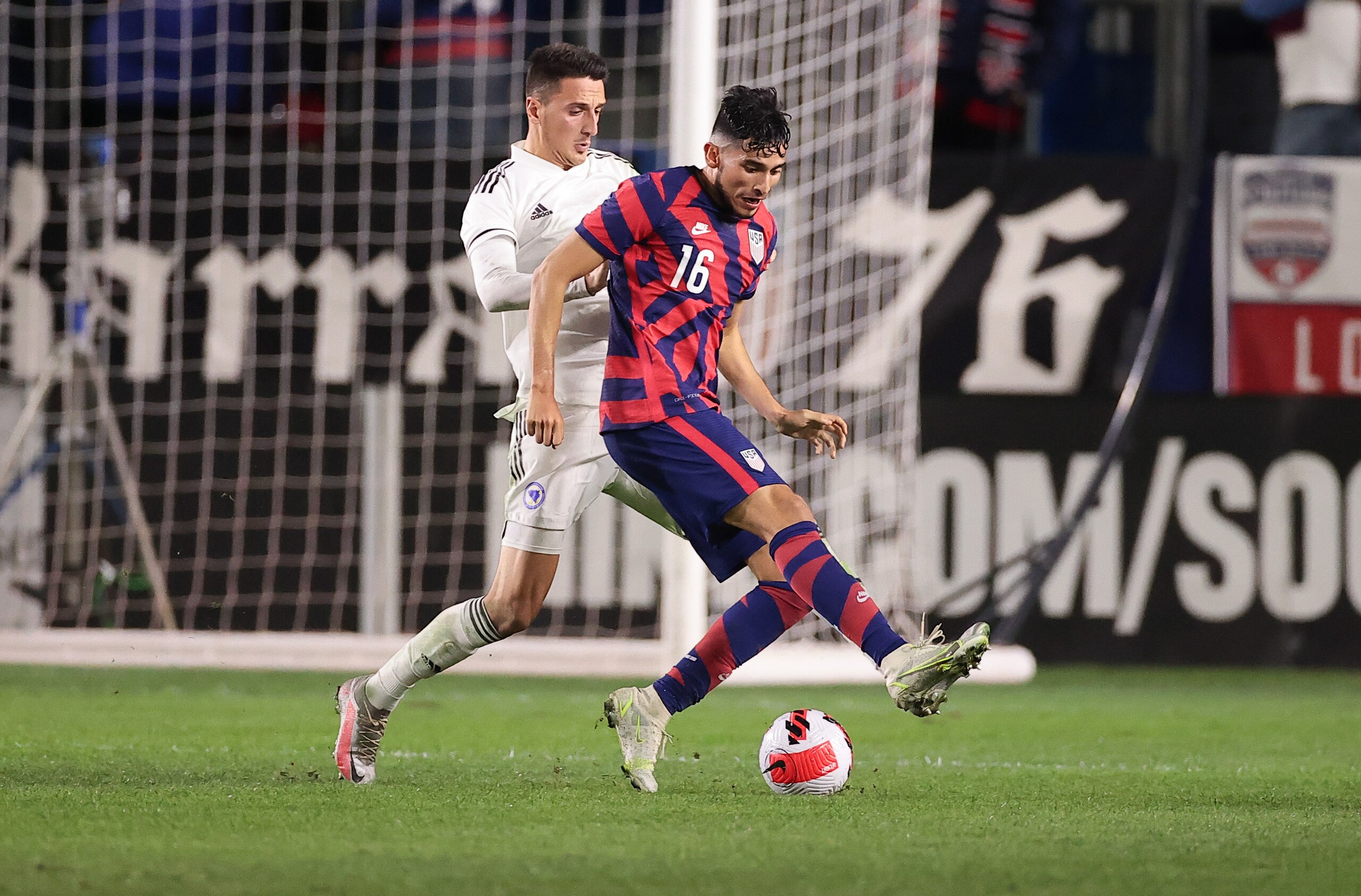 CARSON, CA - DECEMBER 18: Ricardo Pepi #16 of the United States moves with the ball during a game between Bosnia and Herzegovina and USMNT at Dignity Health Sports Park on December 18, 2021 in Carson, California. (Photo by Robert Mora/ISI Photos/Getty Images)