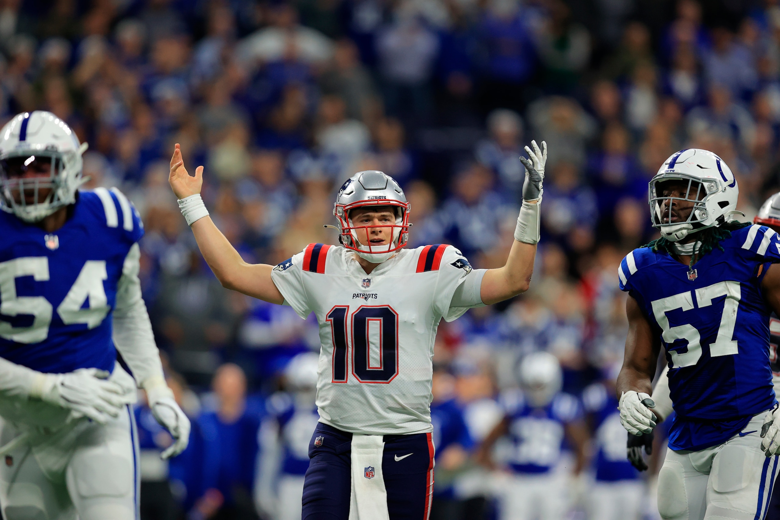 New England Patriots quarterback Mac Jones reacts during the second half of an NFL football game against the Indianapolis Colts Saturday, Dec. 18, 2021, in Indianapolis. (AP Photo/Aaron Doster)