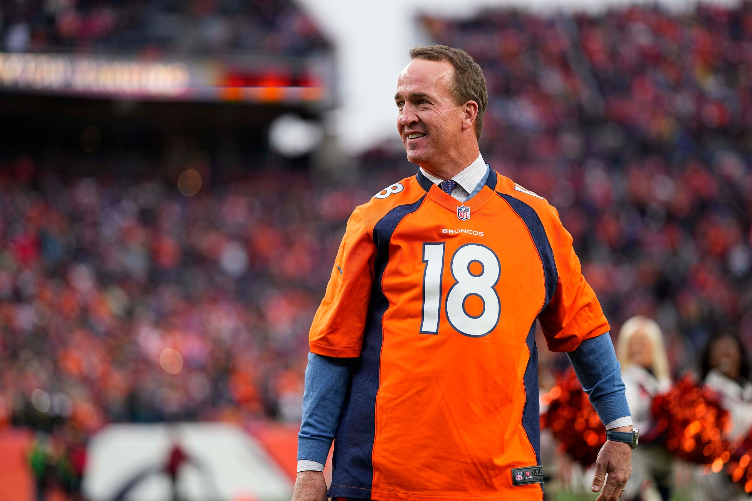 Peyton Manning looks smiles at his Ring of Fame induction ceremony during an NFL football game between the Denver Broncos and the Washington Football Team Sunday, Oct. 31, 2021, in Denver. (AP Photo/Jack Dempsey)