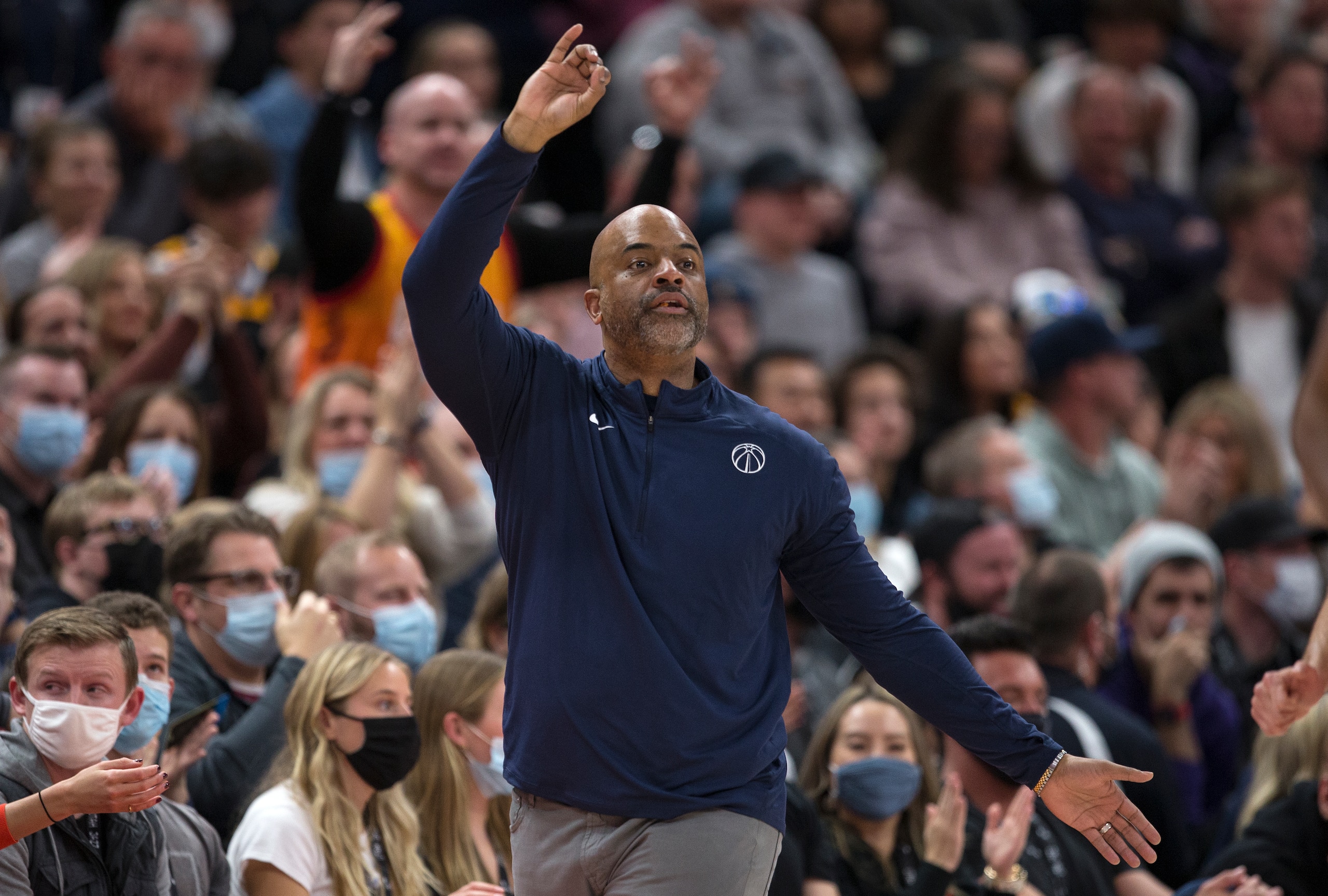 SALT LAKE CITY, UT -  DECEMBER 18:  Wes Unseld Jr., head coach of the Washington Wizards calls in a play during the second half of their game against the Utah Jazz December 18, 2021 at the Vivint Smart Home Arena in Salt Lake City, Utah. NOTE TO USER: User expressly acknowledges and agrees that, by downloading and/or using this Photograph, user is consenting to the terms and conditions of the Getty Images License Agreement.(Photo by Chris Gardner/Getty Images)