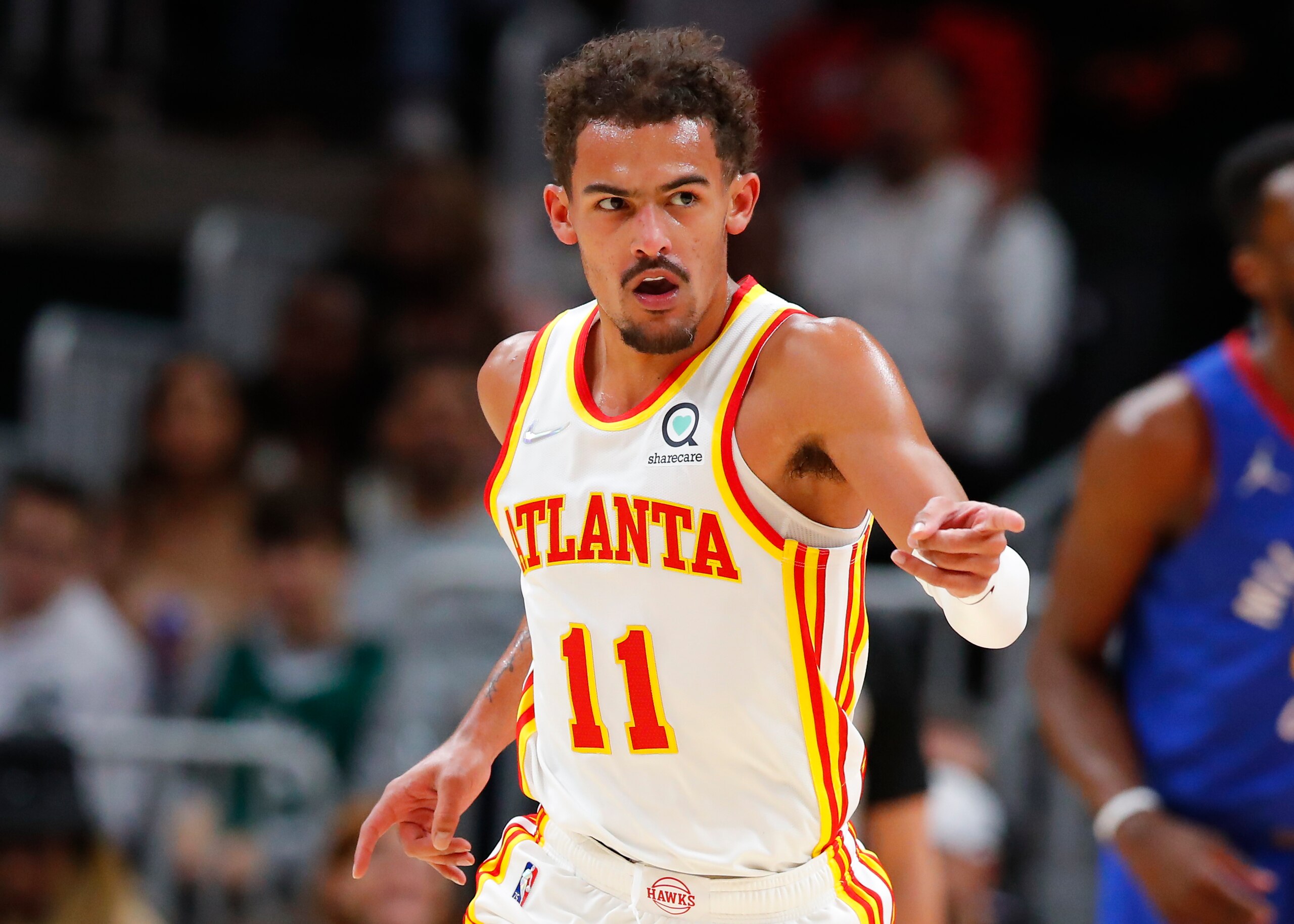 ATLANTA, GA - DECEMBER 17: Trae Young #11 of the Atlanta Hawks reacts during the first half against the Denver Nuggets at State Farm Arena on December 17, 2021 in Atlanta, Georgia. NOTE TO USER: User expressly acknowledges and agrees that, by downloading and or using this photograph, User is consenting to the terms and conditions of the Getty Images License Agreement. (Photo by Todd Kirkland/Getty Images) ATLANTA, GA - DECEMBER 17: Trae Young #11 of the Atlanta Hawks reacts during the first half against the Denver Nuggets at State Farm Arena on December 17, 2021 in Atlanta, Georgia. NOTE TO USER: User expressly acknowledges and agrees that, by downloading and or using this photograph, User is consenting to the terms and conditions of the Getty Images License Agreement. (Photo by Todd Kirkland/Getty Images)