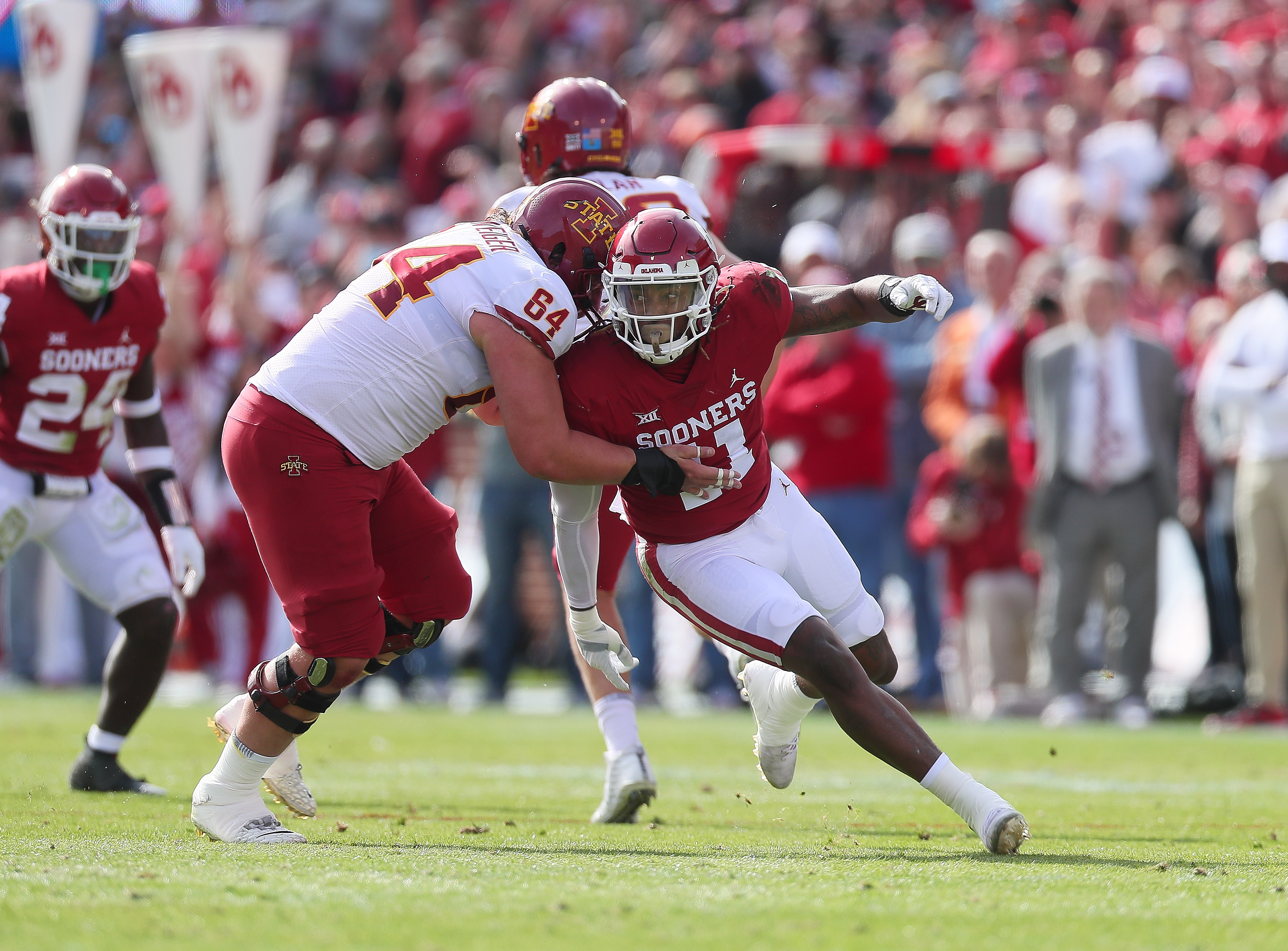 NORMAN, OK - NOVEMBER 20: Oklahoma Sooners OLB Nik Bonitto (11) works around the block of Iowa State Cyclones OL Derek Schweiger (64) during a game between the Oklahoma Sooners and the Iowa State Cyclones on November 20, 2021, at Gaylord Memorial Stadium in Norman, Oklahoma. (Photo by David Stacy/Icon Sportswire via Getty Images)