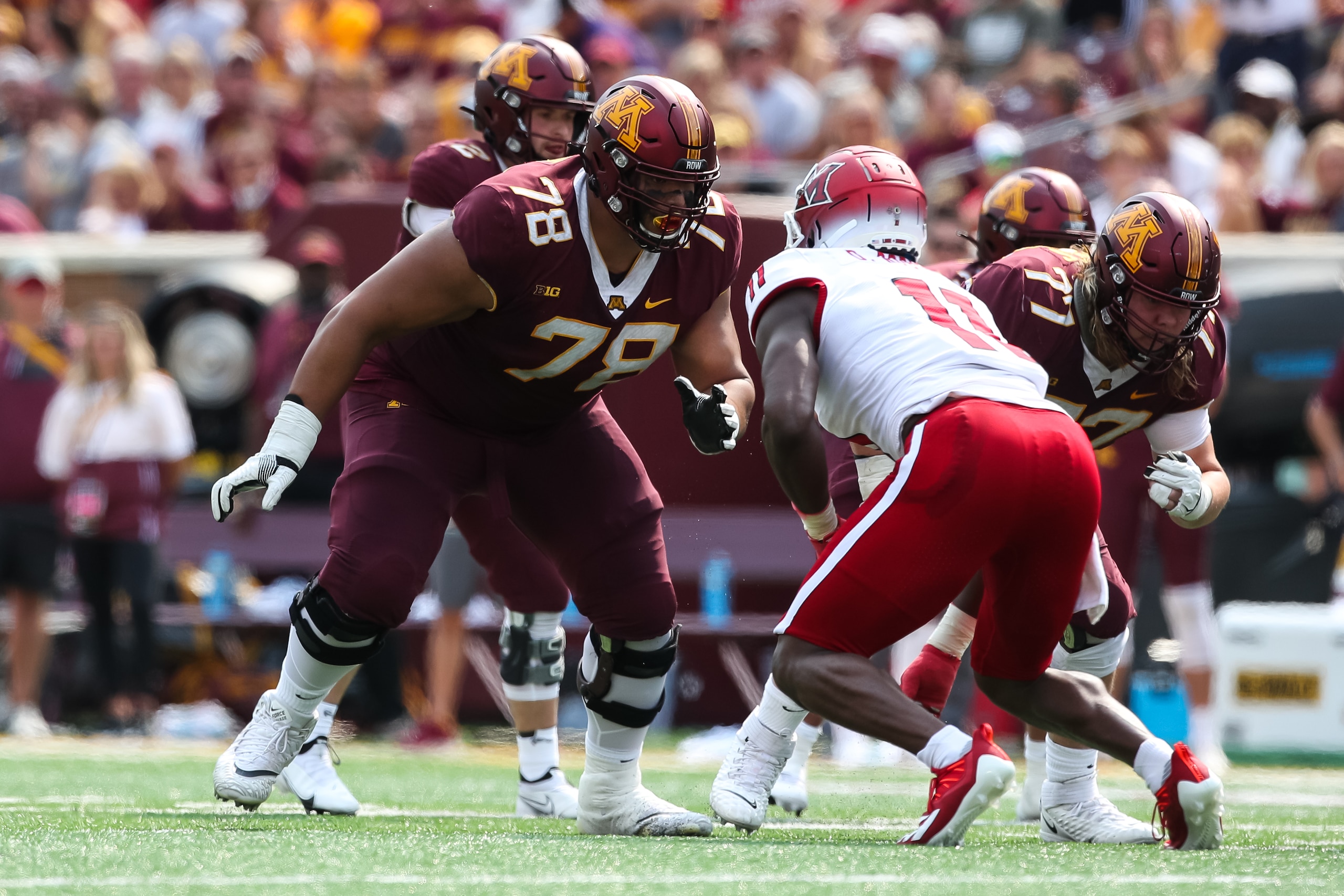 MINNEAPOLIS, MN - SEPTEMBER 11: Daniel Faalele #78 of the Minnesota Golden Gophers competes against Dominique Robinson #11 of the Miami (Oh) Redhawks in the third quarter of the game at Huntington Bank Stadium on September 11, 2021 in Minneapolis, Minnesota. The Gophers defeated the Redhawks 31-26. (Photo by David Berding/Getty Images)