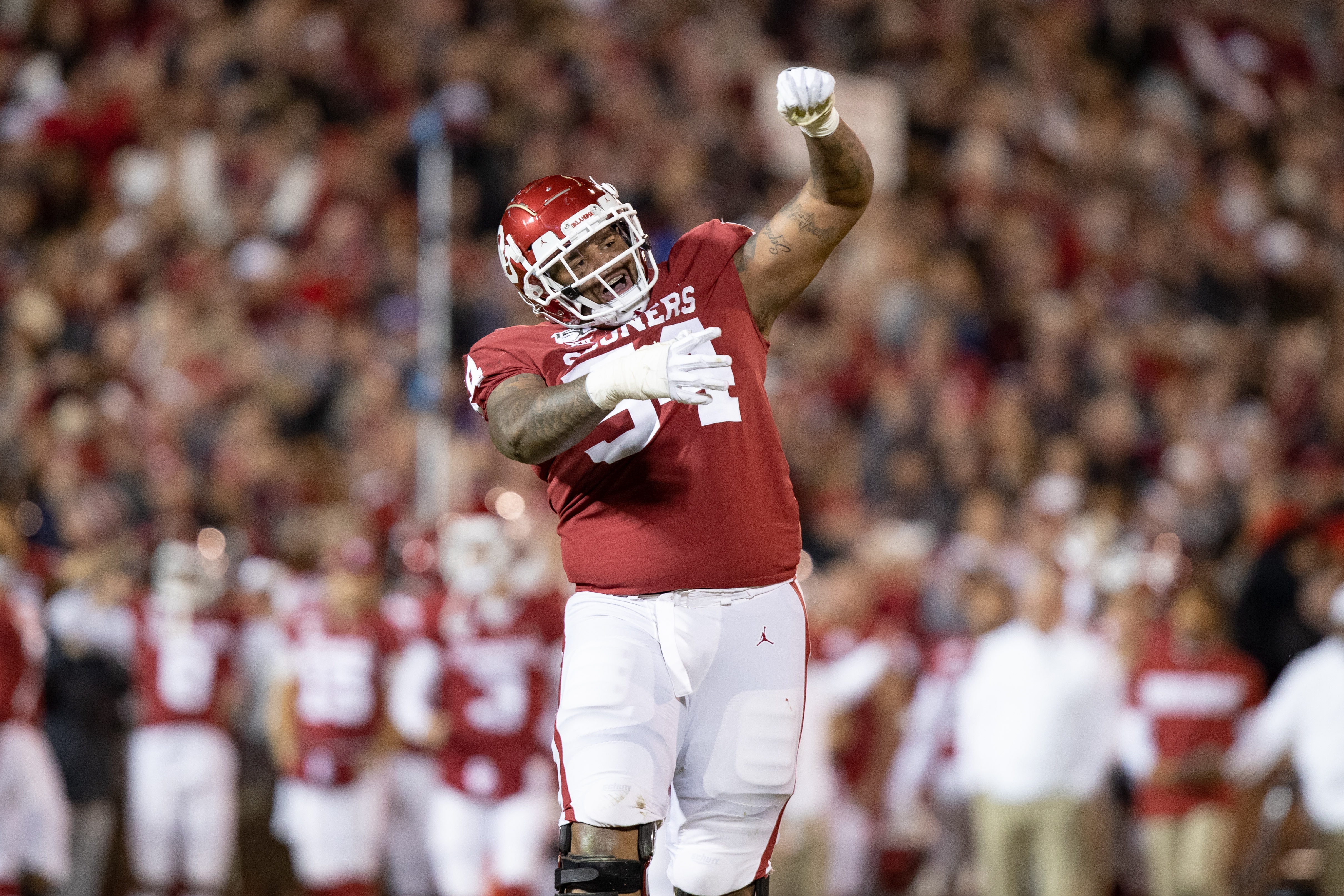 NORMAN, OK - NOVEMBER 23: Oklahoma Sooners offensive lineman Marquis Hayes (#54) celebrates a touchdown during the Big 12 college football game between the Oklahoma Sooners and the TCU Horned Frogs on November 23, 2019, at Gaylord Family Oklahoma Memorial Stadium in Norman, OK.  (Photo by Matthew Visinsky/Icon Sportswire via Getty Images).