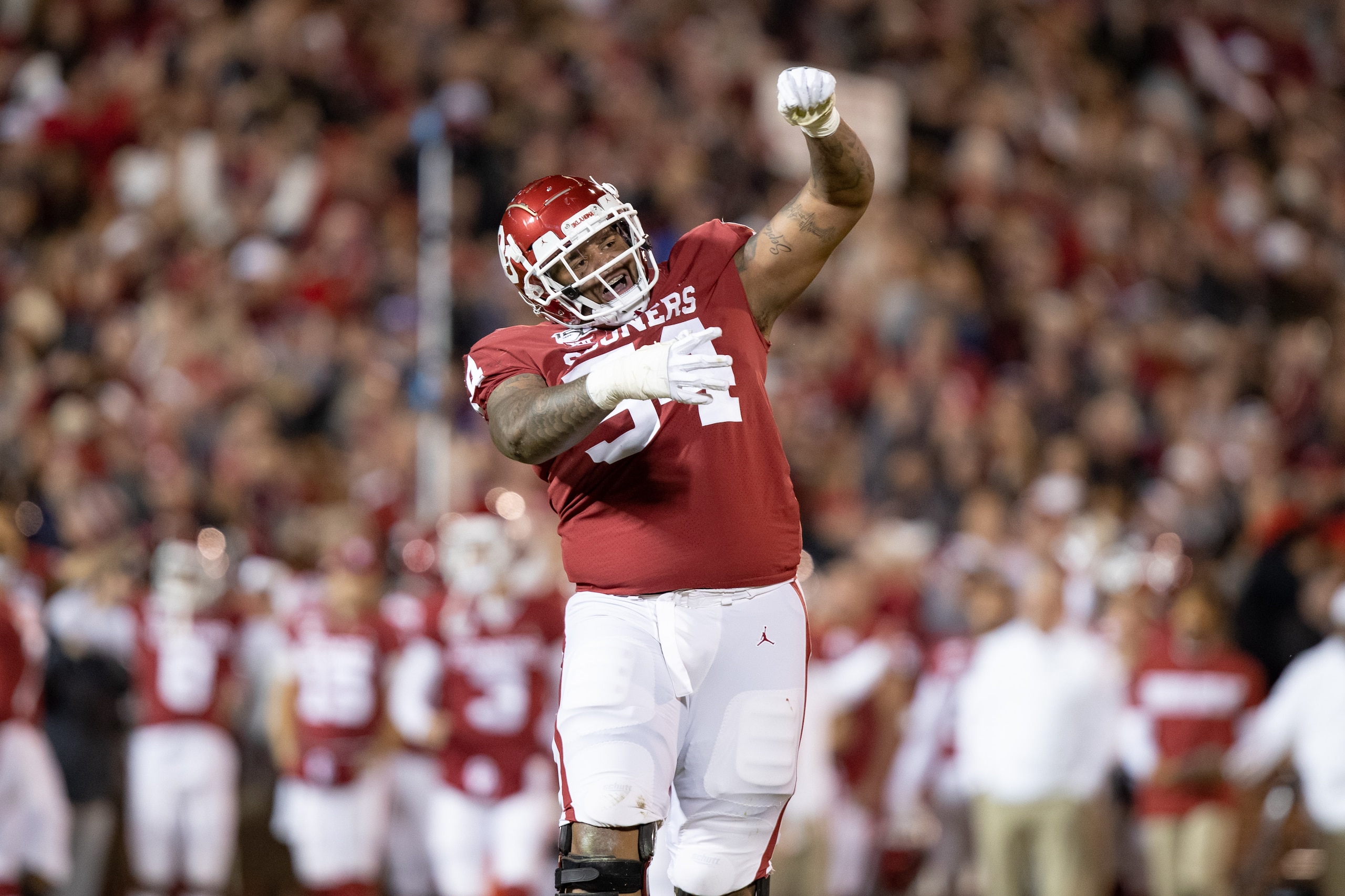 NORMAN, OK - NOVEMBER 23: Oklahoma Sooners offensive lineman Marquis Hayes (#54) celebrates a touchdown during the Big 12 college football game between the Oklahoma Sooners and the TCU Horned Frogs on November 23, 2019, at Gaylord Family Oklahoma Memorial Stadium in Norman, OK. (Photo by Matthew Visinsky/Icon Sportswire via Getty Images). NORMAN, OK - NOVEMBER 23: Oklahoma Sooners offensive lineman Marquis Hayes (#54) celebrates a touchdown during the Big 12 college football game between the Oklahoma Sooners and the TCU Horned Frogs on November 23, 2019, at Gaylord Family Oklahoma Memorial Stadium in Norman, OK. (Photo by Matthew Visinsky/Icon Sportswire via Getty Images).