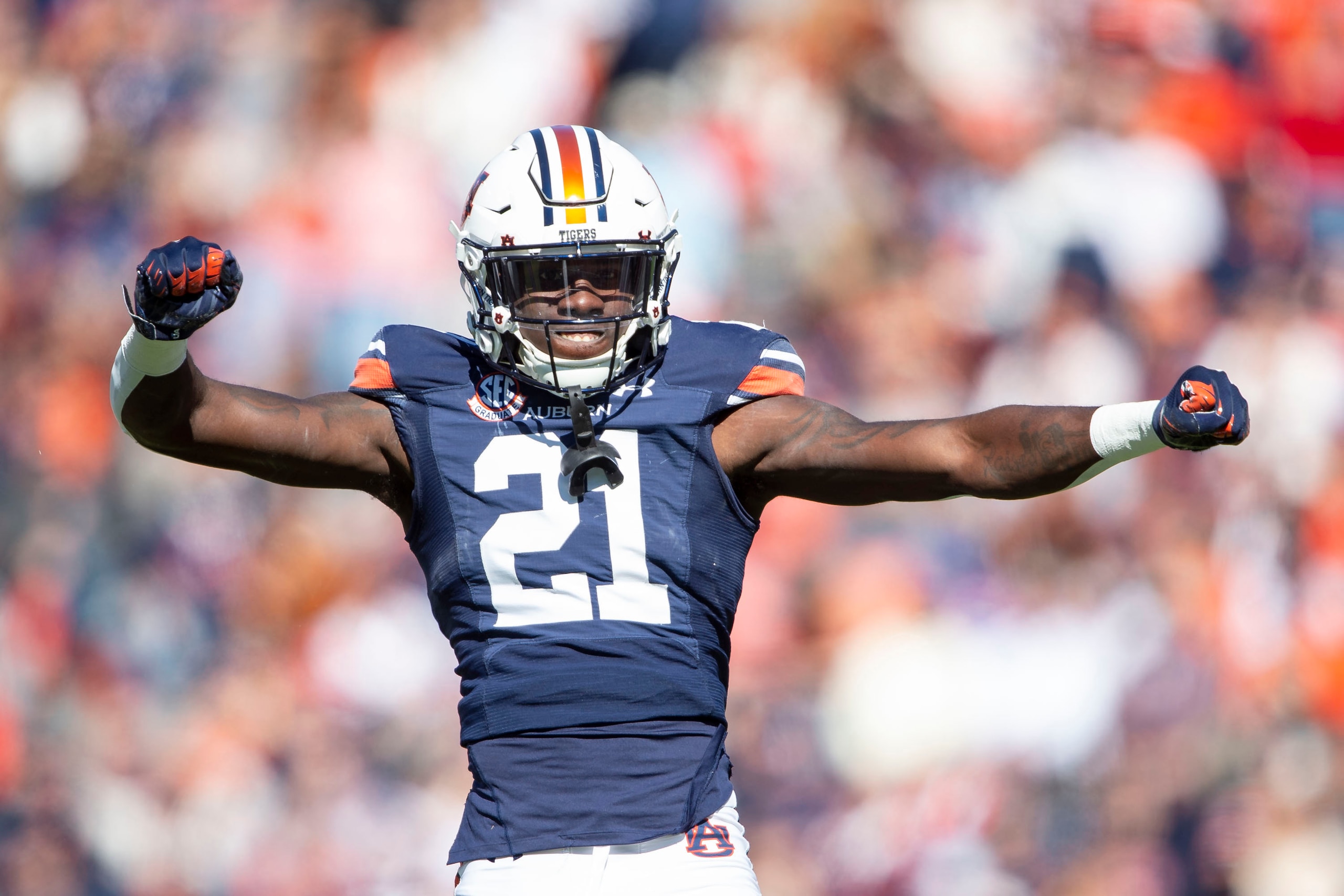 AUBURN, ALABAMA - NOVEMBER 13: Safety Smoke Monday #21 of the Auburn Tigers celebrates after a big play during their game against the Mississippi State Bulldogs at Jordan-Hare Stadium on November 13, 2021 in Auburn, Alabama. (Photo by Michael Chang/Getty Images)