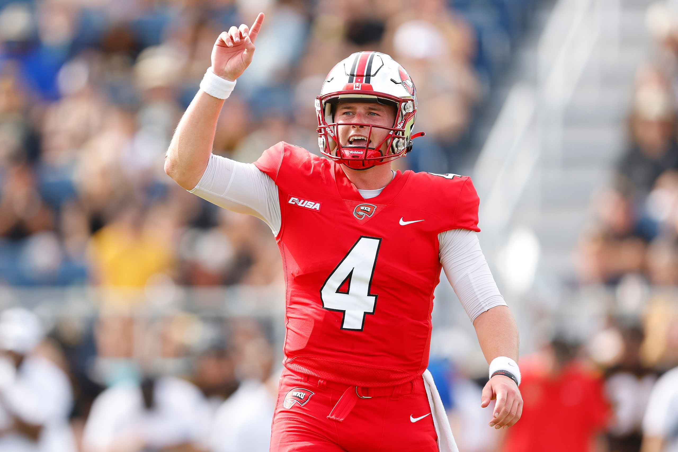 BOCA RATON, FLORIDA - DECEMBER 18: Bailey Zappe #4 of the Western Kentucky Hilltoppers celebrates after setting the all-time single season passing record against the Appalachian State Mountaineers during the second quarter of the RoofClaim.com Boca Raton Bowl at FAU Stadium on December 18, 2021 in Boca Raton, Florida. (Photo by Michael Reaves/Getty Images) BOCA RATON, FLORIDA - DECEMBER 18: Bailey Zappe #4 of the Western Kentucky Hilltoppers celebrates after setting the all-time single season passing record against the Appalachian State Mountaineers during the second quarter of the RoofClaim.com Boca Raton Bowl at FAU Stadium on December 18, 2021 in Boca Raton, Florida. (Photo by Michael Reaves/Getty Images)