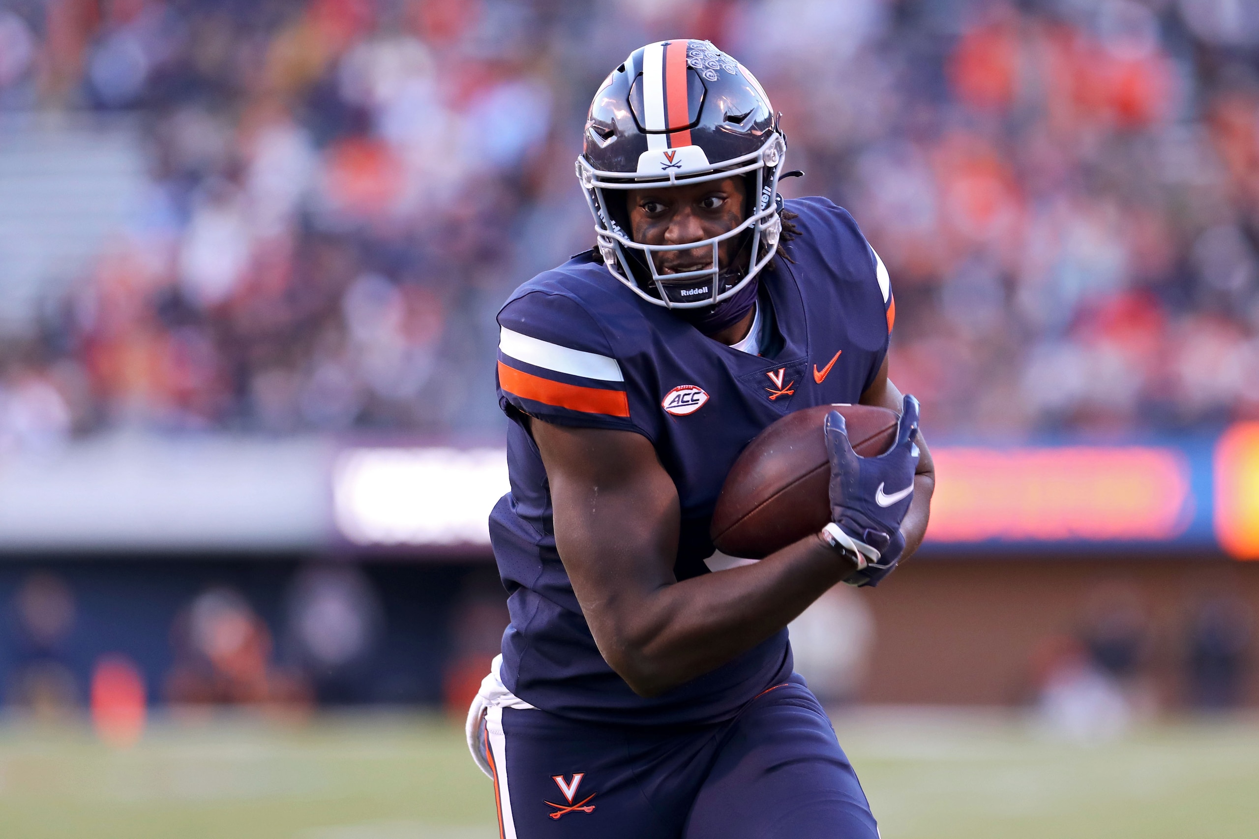 CHARLOTTESVILLE, VA - NOVEMBER 27: Jelani Woods #0 of the Virginia Cavaliers catches a pass in the first half during a game against the Virginia Tech Hokies at Scott Stadium on November 27, 2021 in Charlottesville, Virginia. (Photo by Ryan M. Kelly/Getty Images) CHARLOTTESVILLE, VA - NOVEMBER 27: Jelani Woods #0 of the Virginia Cavaliers catches a pass in the first half during a game against the Virginia Tech Hokies at Scott Stadium on November 27, 2021 in Charlottesville, Virginia. (Photo by Ryan M. Kelly/Getty Images)