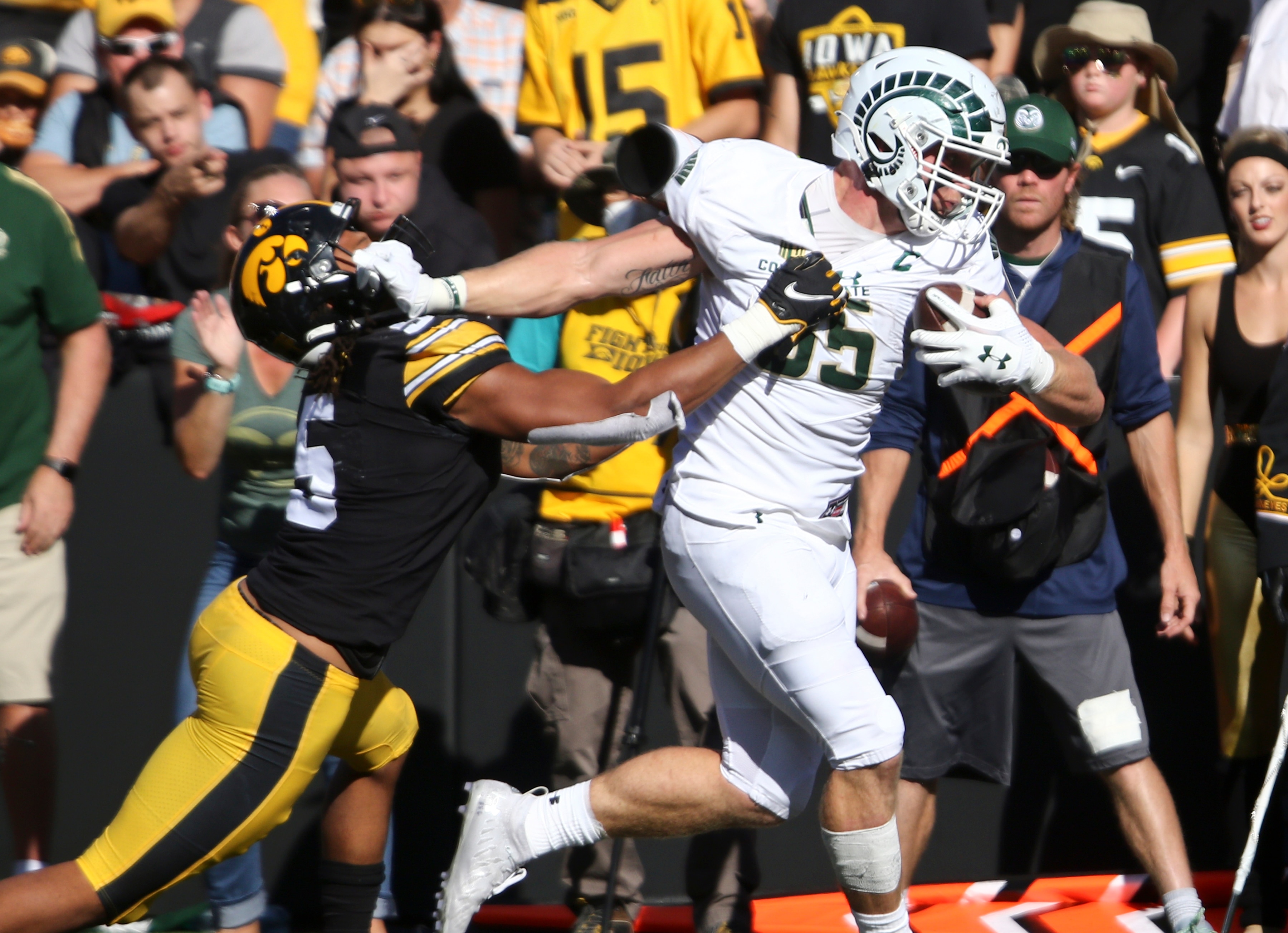 IOWA CITY, IOWA- SEPTEMBER 25:  Tight end Trey McBride #85 of the Colorado State Rams fights off a tackle during the first half by linebacker Jestin Jacobs #5 of the Iowa Hawkeyes at Kinnick Stadium on September 25, 2021 in Iowa City, Iowa.  (Photo by Matthew Holst/Getty Images)